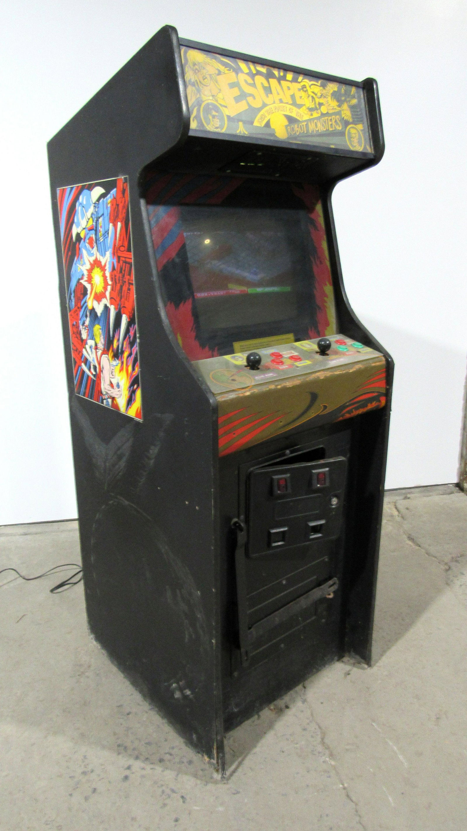 Atari Escape from the Planet of the Robot Monsters: Atari Escape from the Planet of the Robot Monsters. Partially working, monitor needs adjusting. This item requires third party shipping or pickup arrangements to be made. Dimensions: 70 x 26 x 28.5