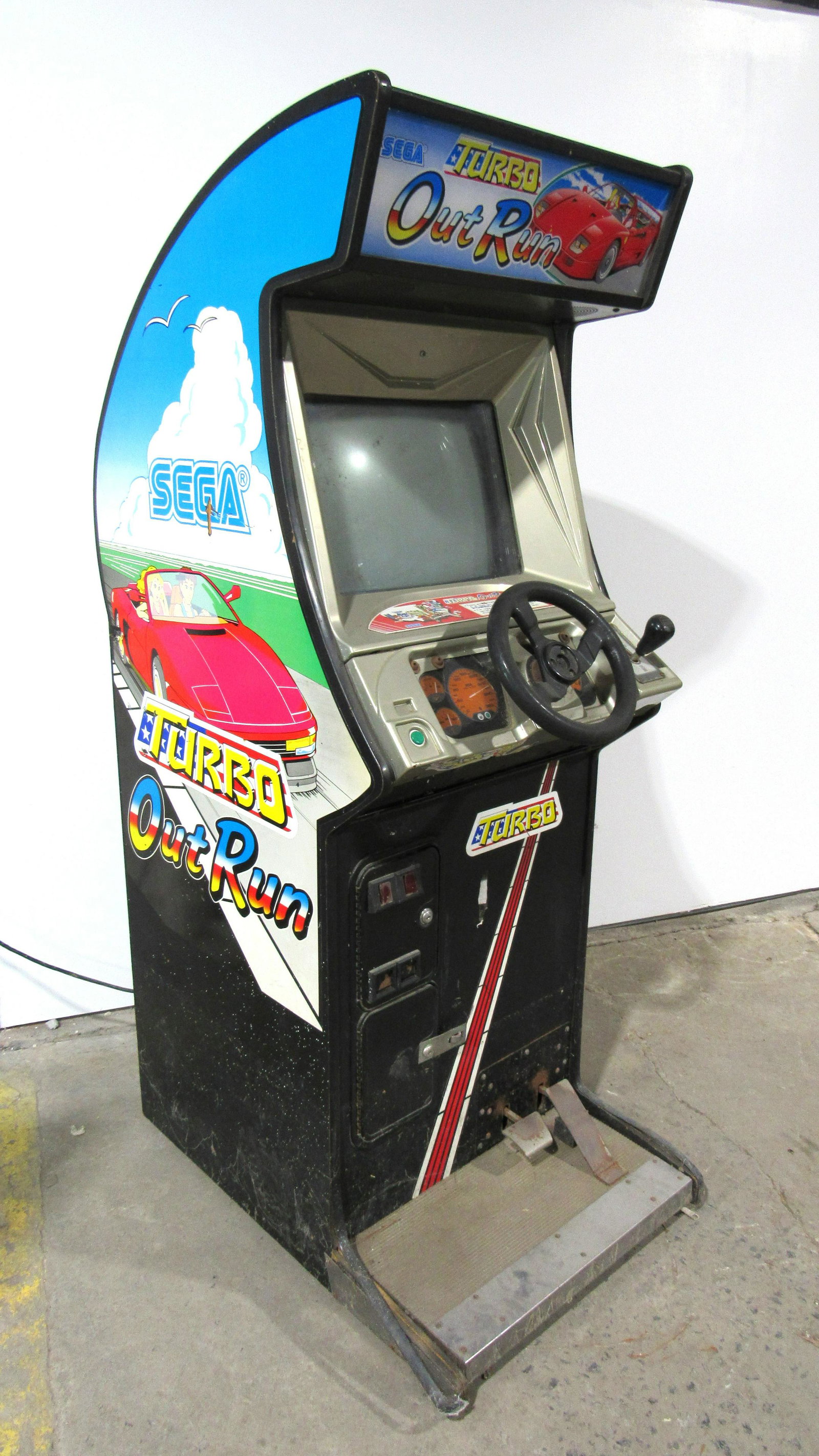 Sega Turbo Out Run Racing Arcade Game: Sega Turbo Out Run Racing Arcade Game. Complete, not working. This item requires third party shipping or pickup arrangements to be made. Dimensions: 72 x 25.5 x 38