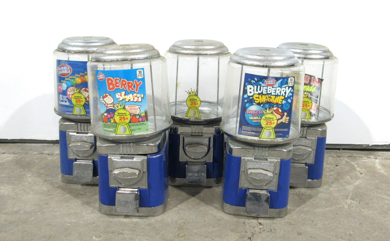 Five Richland 25 Cent Gumball Machines: Five Richland 25 Cent Gumball Machines. Locks not included. This item requires third party shipping or pickup arrangements to be made. Dimensions for one: 16 x 8 x 8