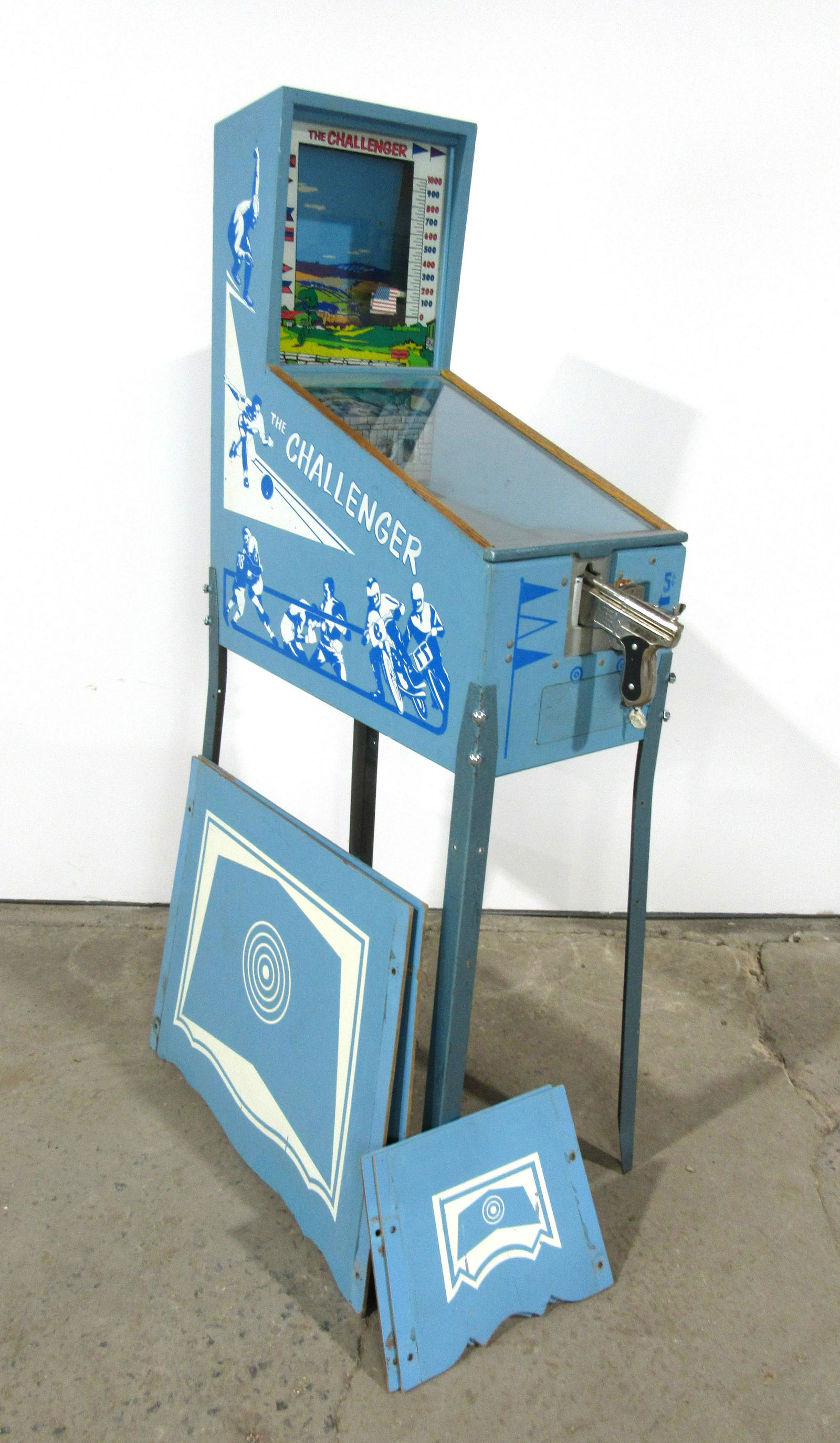 The Challenger Coin Operated Shooting Gallery Arcade: The Challenger Coin Operated Shooting Gallery Arcade Game. This item requires third party shipping or pickup arrangements to be made. Dimensions: 66 x 15 x 34
