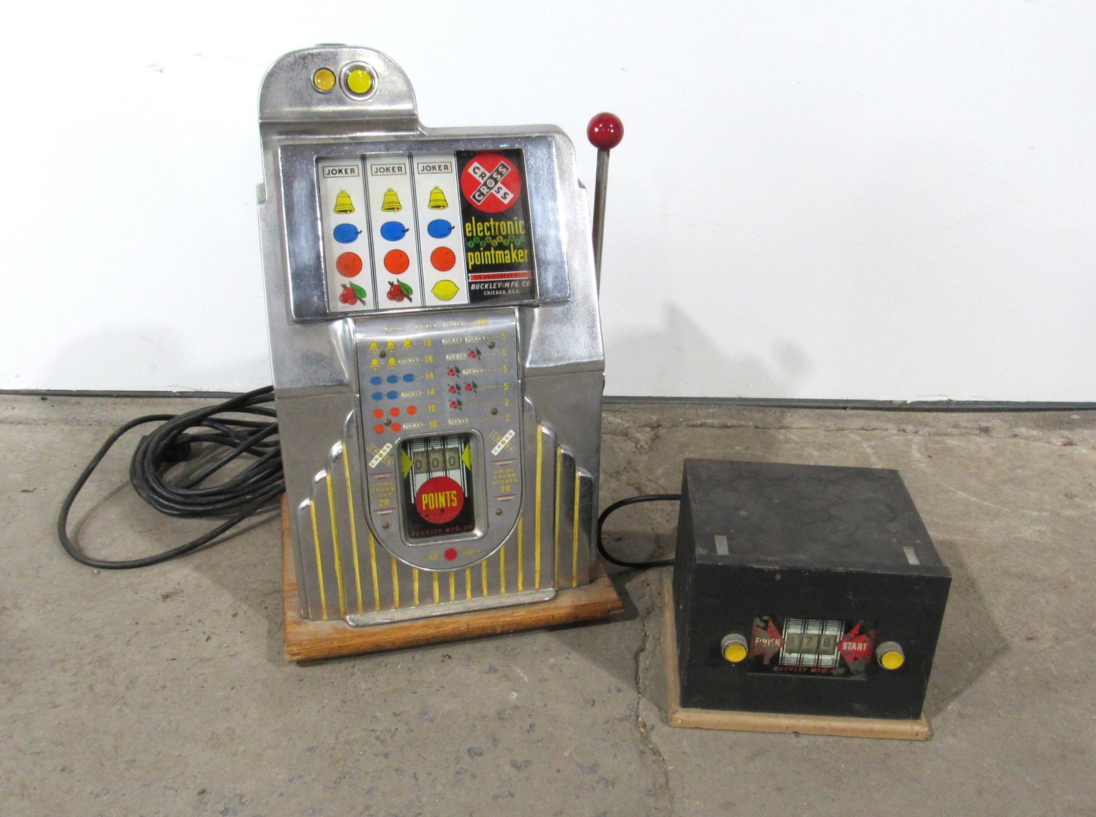 Buckley Pointmaker Slot Machine with Master Unit: Buckley Pointmaker Coin Operated Slot Machine with Master Unit. Includes backdoor, missing bonnet. This item requires third party shipping or pickup arrangements to be made. Dimensions: 26 x 18 x 16