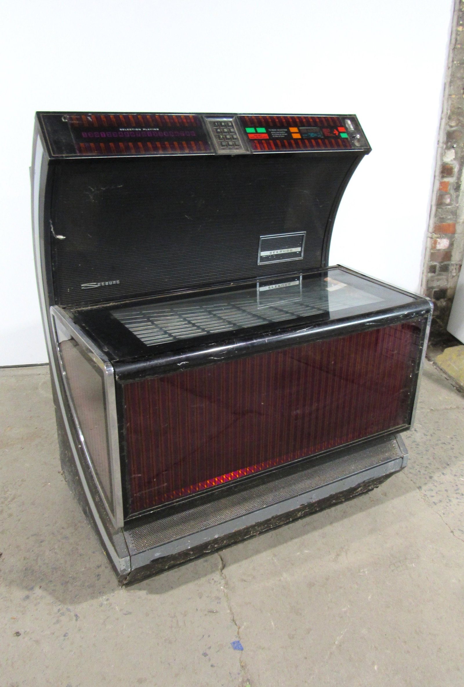 1970s Seeburg Coin Operated Jukebox: 1970s Seeburg Coin Operated Jukebox. Untested, sold as-is. This item requires third party shipping or pickup arrangements to be made. Dimensions: 51 x 40 x 30