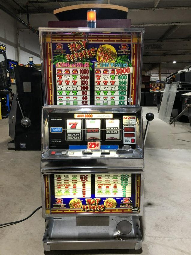 Hot Peppers Coin Operated Slot Machine: Hot Peppers Coin Operated Slot Machine, working. This item requires third party shipping or pickup arrangements to be made. Dimensions: 54 x 24 x 22