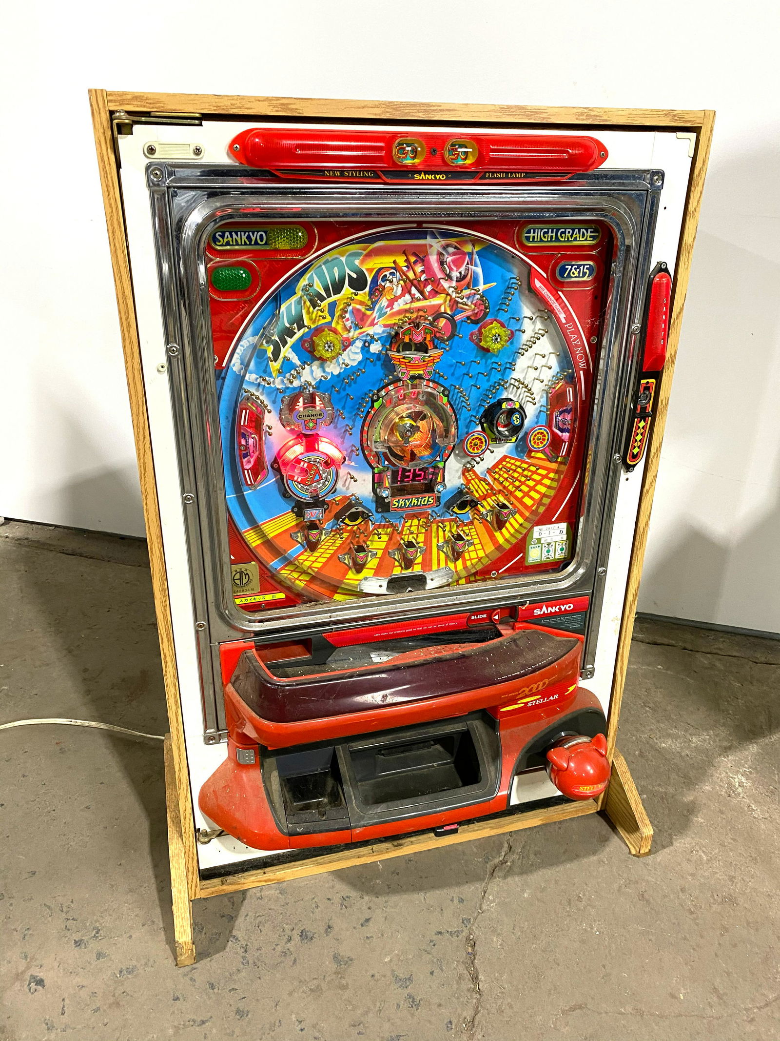 Sky Kids Pachinko Coin Operated Arcade Game: Sky Kids Pachinko Coin Operated Arcade Game. Lights up, not otherwise tested. Balls included. This item requires third party shipping or pickup arrangements to be made. Dimensions: 34 x 23 x 15