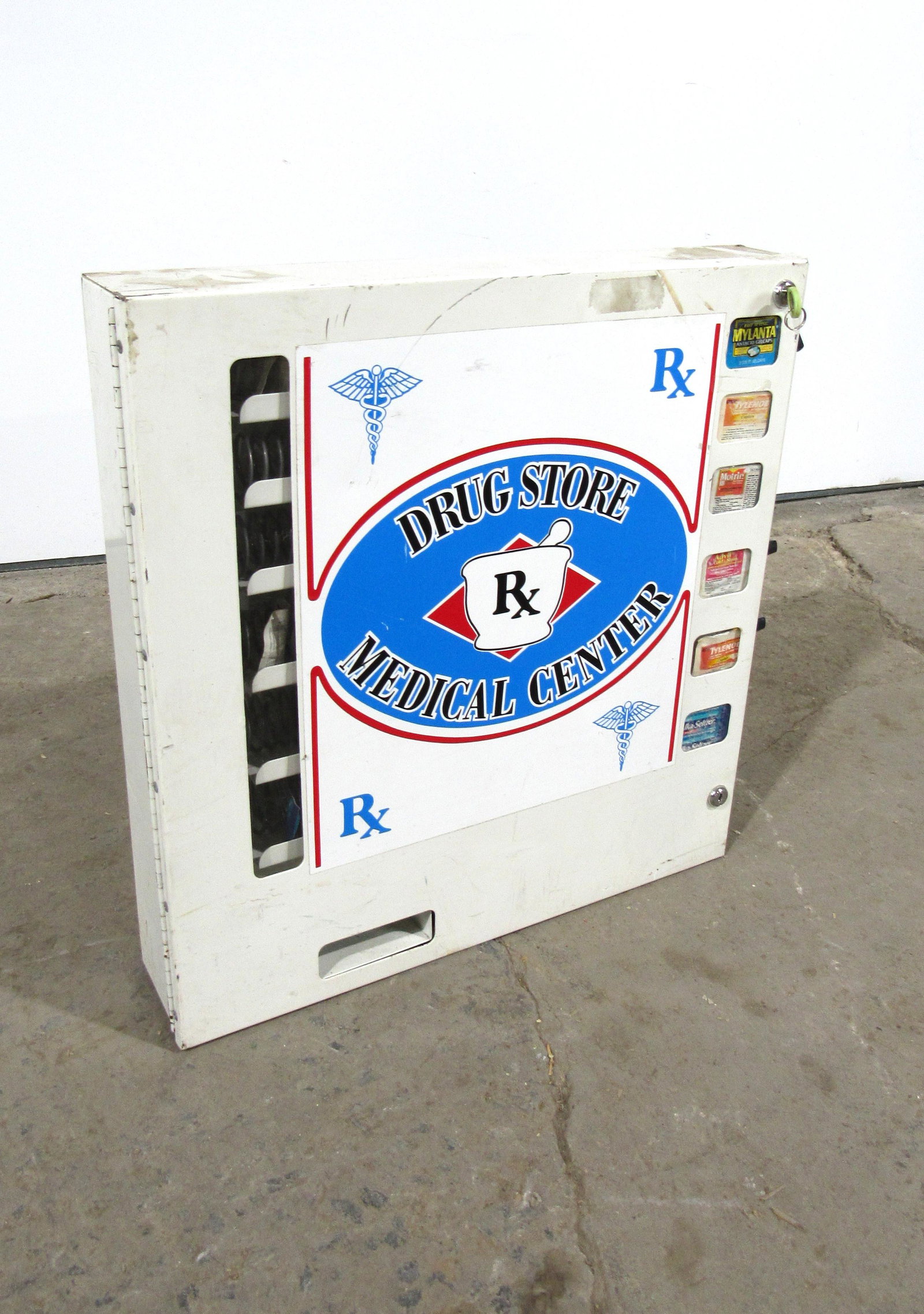 Drug Store Wallmount Vending Machine: Drug Store Wallmount Vending Machine. This item requires third party shipping or pickup arrangements to be made. Dimensions: 23 x 22 x 5
