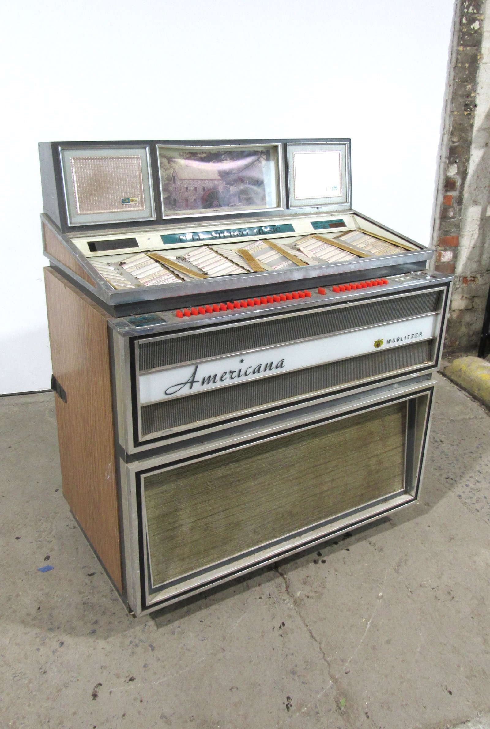 Wurlitzer Americana Model 3100 Coin Operated Jukebox.: Wurlitzer Americana Model 3100 Coin Operated Jukebox. Untested, sold as-is. This item requires third party shipping or pickup arrangements to be made. Dimensions: 49 x 40 x 25
