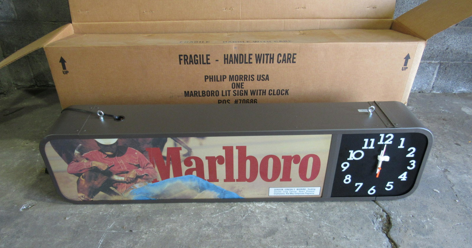 NIB Philip Morris Marlboro Light Up Advertising Clock: New in Box Philip Morris Marlboro Light Up Advertising Clock. This item requires third party shipping or pickup arrangements to be made. Box Dimensions: 20 x 60 x 13