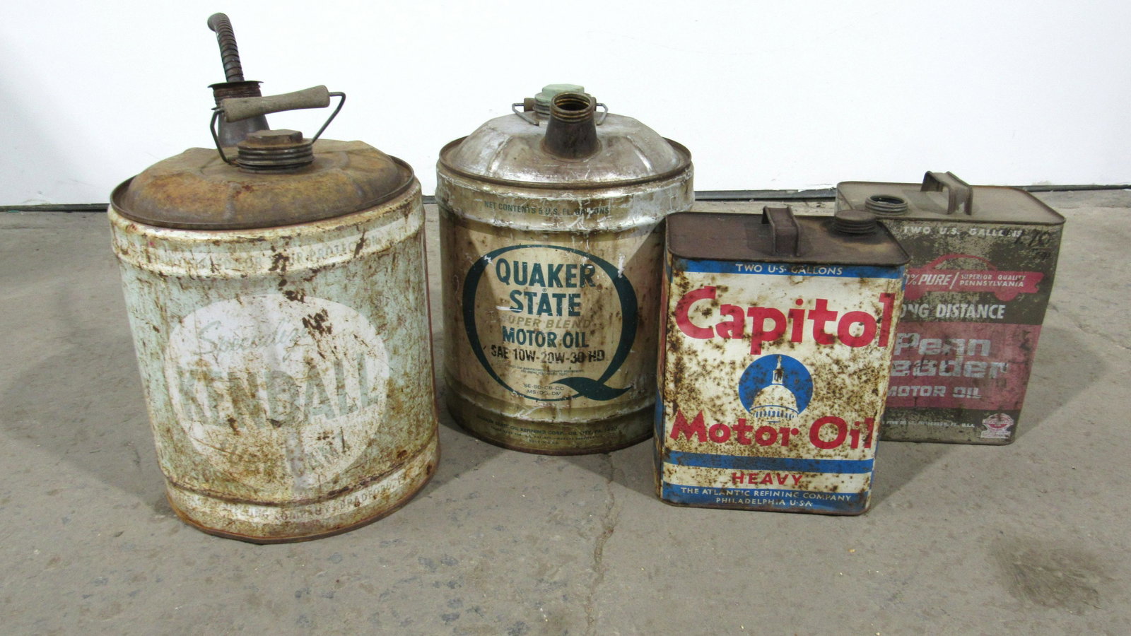 Four Vintage Oil Cans Including Quaker State: Four Vintage Oil Cans Including Quaker State. This item requires third party shipping or pickup arrangements to be made. Dimensions of Kendall: 18 x 12 x 12