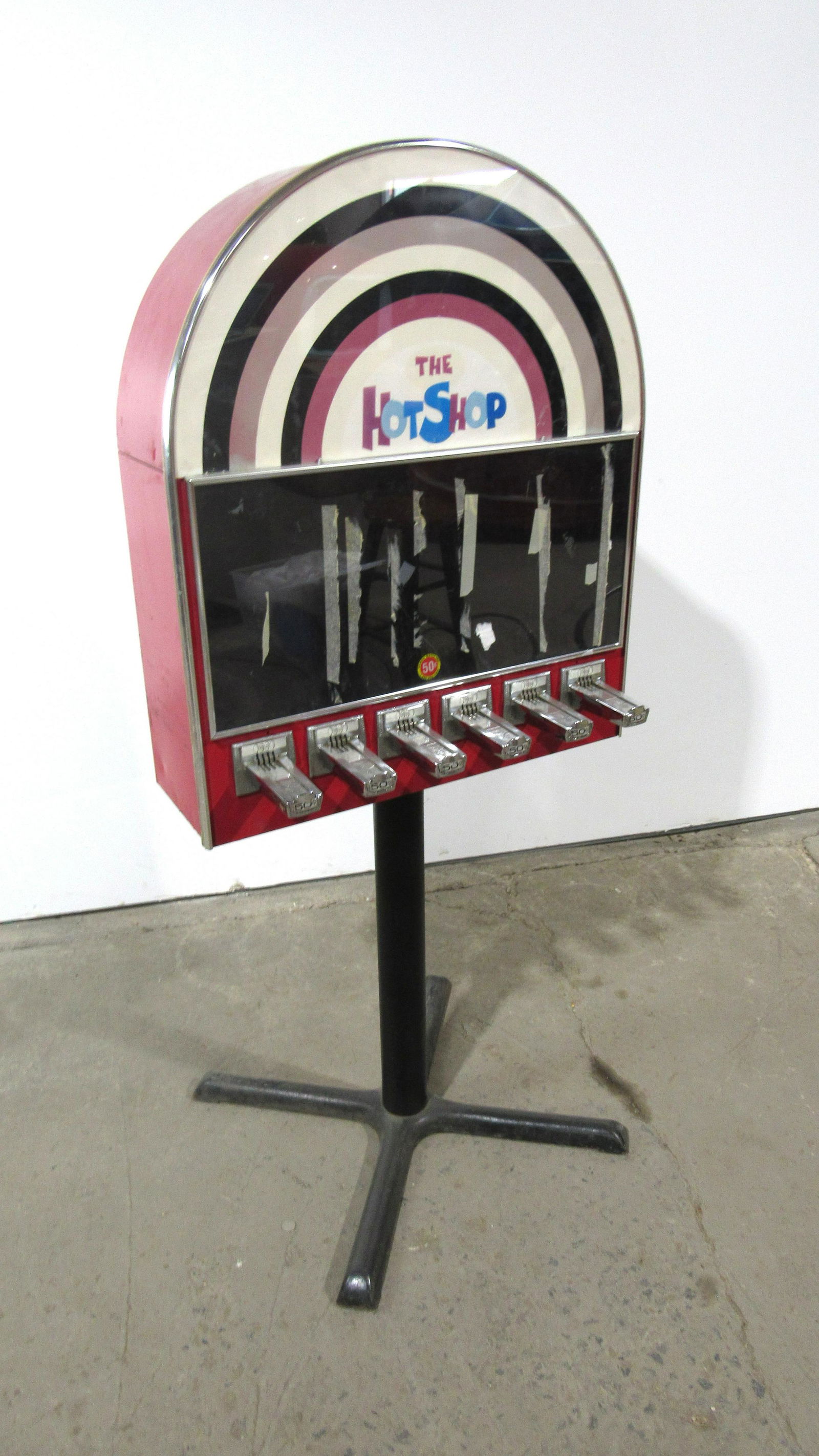 "The Hot Shop" Coin Operated Sticker Vending Machine: Hot Shop Coin Operated Sticker Vending Machine. Lock not included. This item requires third party shipping or pickup arrangements to be made. Dimensions: 59 x 27 x 29