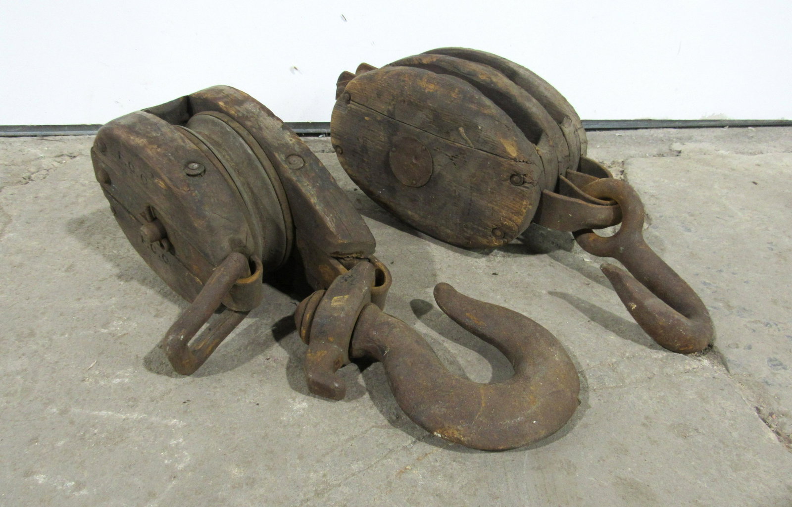 Two Antique Wood and Metal Pulleys: Two Antique Wood and Metal Pulleys. In-house shipping available. Dimensions of one: 20 x 7 x 8