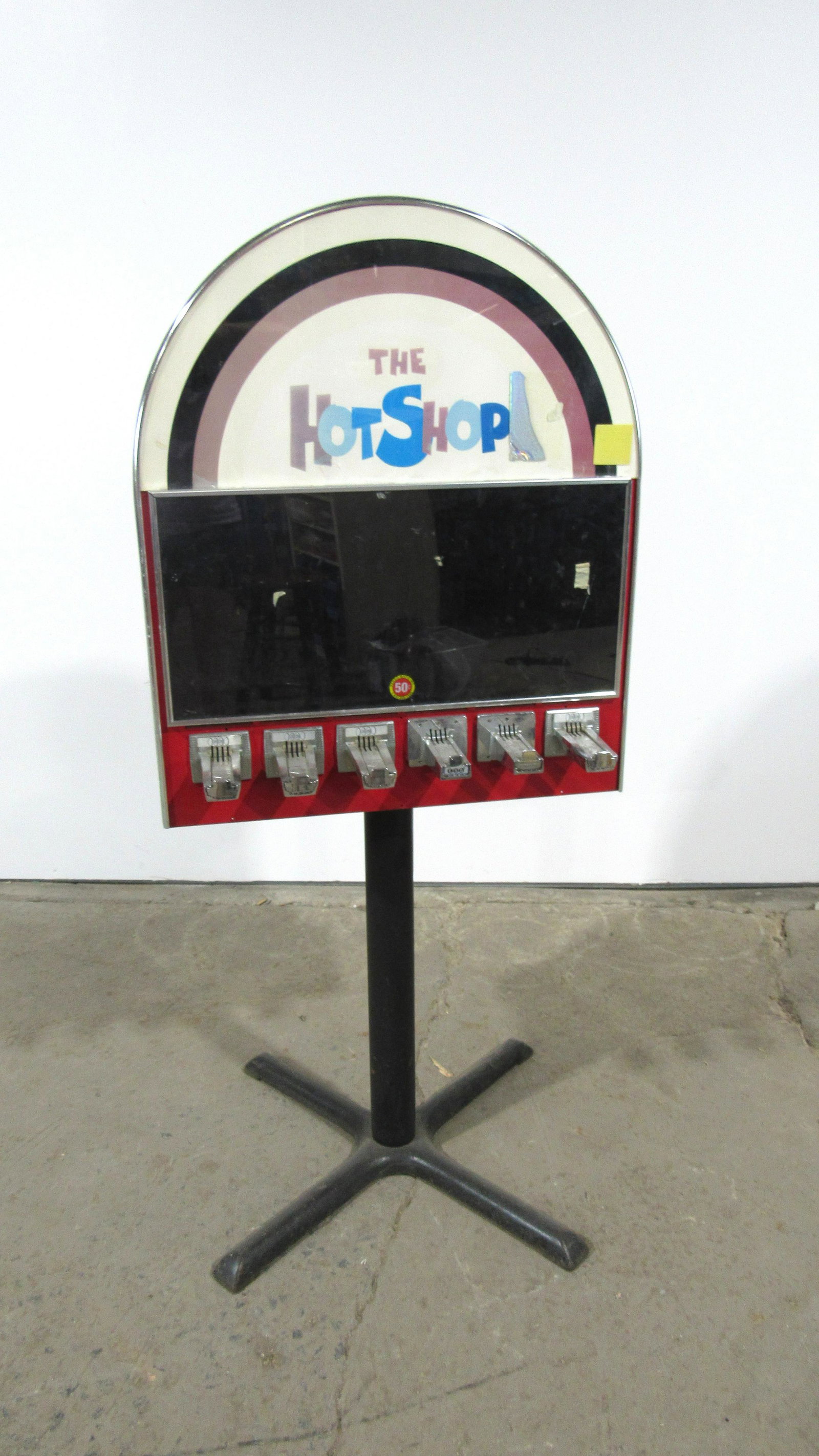 "The Hot Shop" Coin Operated Sticker Machine: "The Hot Shop" Coin Operated Sticker Machine. Lock not included. This item requires third party shipping or pickup arrangements to be made. Dimensions: 59 x 27 x 29