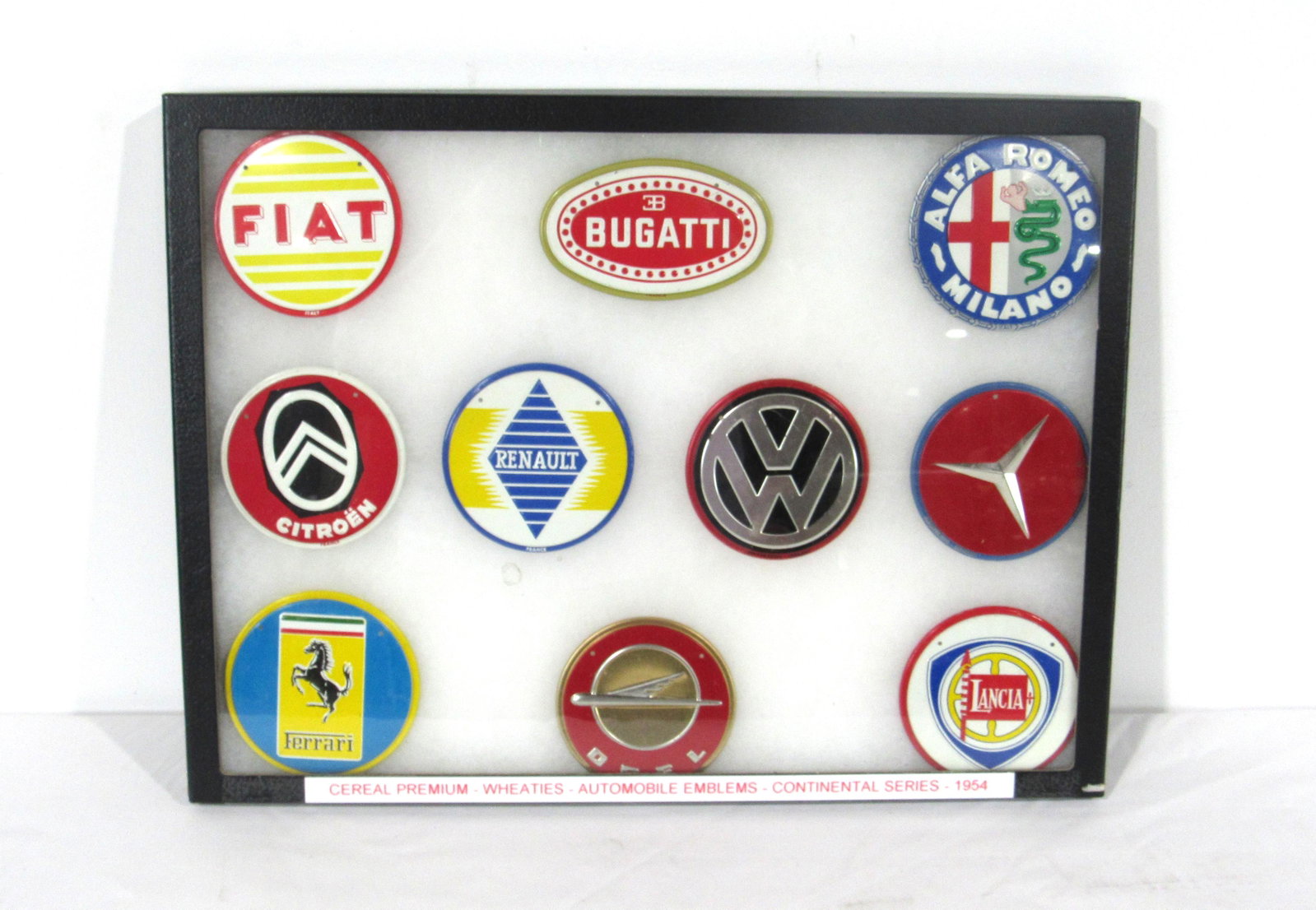 1954 Wheaties Automobile Emblems, Continental Series: 1954 Wheaties Automobile Emblems, Continental Series. Total of 10 emblems that include Ferrari, Fiat and Bugatti. In-house shipping available. Dimensions of box: 13 x 16.5 x 1