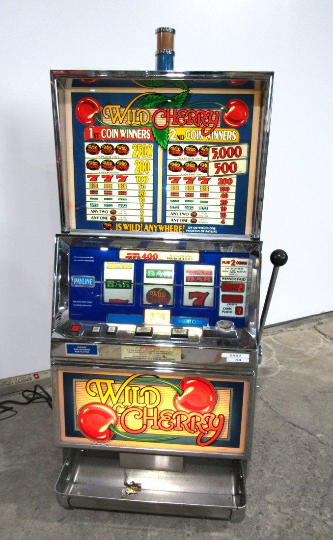 IGT Wild Cherry Coin Operated Slot Machine: IGT Wild Cherry Slot Coin Operated Machine, working. This item requires third party shipping or pickup arrangements to be made. Dimensions: 53 x 24 x 23