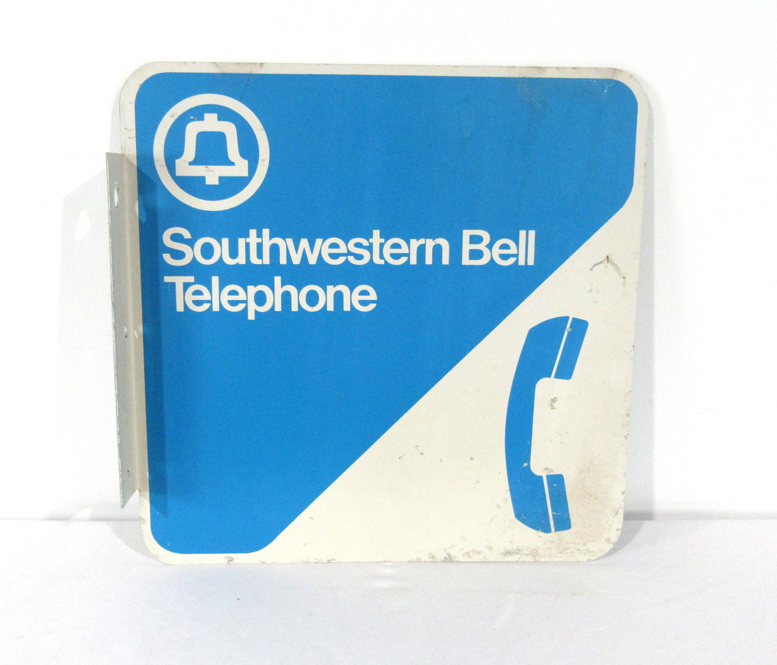 Southwestern Bell Telephone Flange Sign: Southwestern Bell Telephone Flange Sign. In-house shipping available. Dimensions: 18 x 18 x 1