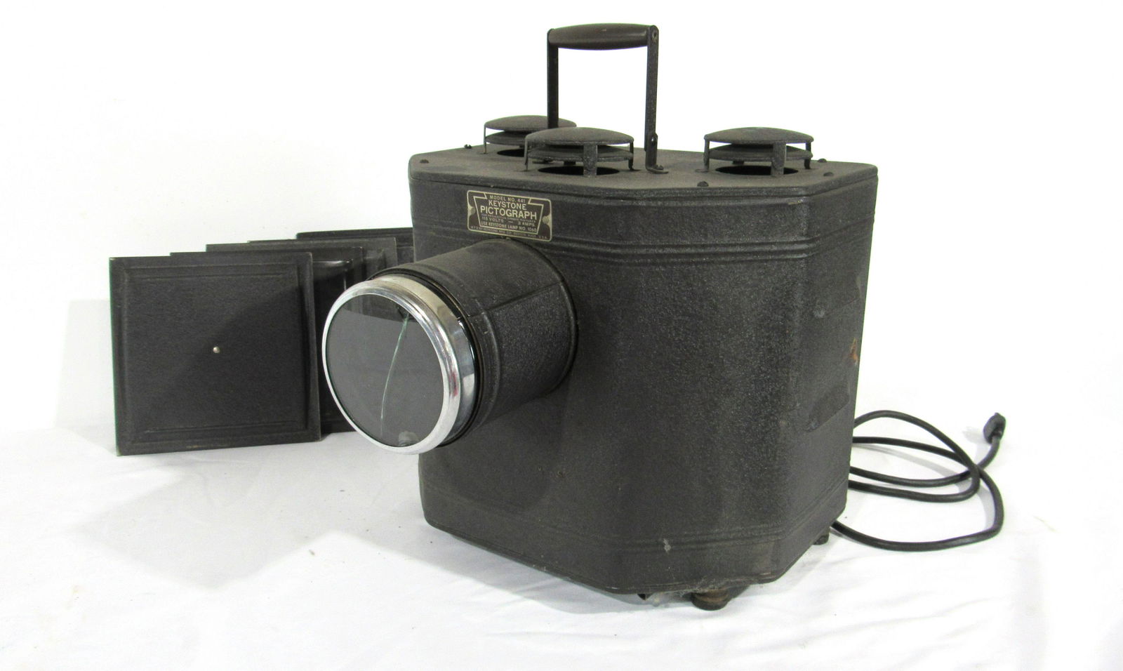 1930s Keystone Pictograph Projector Model 441: 1930s Keystone Pictograph Projector with Slide Holders, Model 441. This item requires third party shipping or pickup arrangements to be made. Dimensions: 12 x 12 x 14