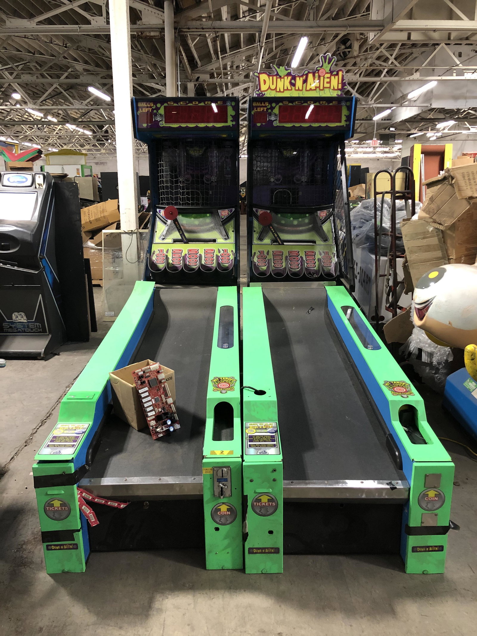 ICE Dunk N' Alien Skee Ball Machines: Pair of ICE Dunk N' Alien Skee Ball Machines. Untested, sold as-is. Has boards.This item requires third party shipping or pickup arrangements to be made. Dimensions: 90 x 30 x 130, lane measures 85".