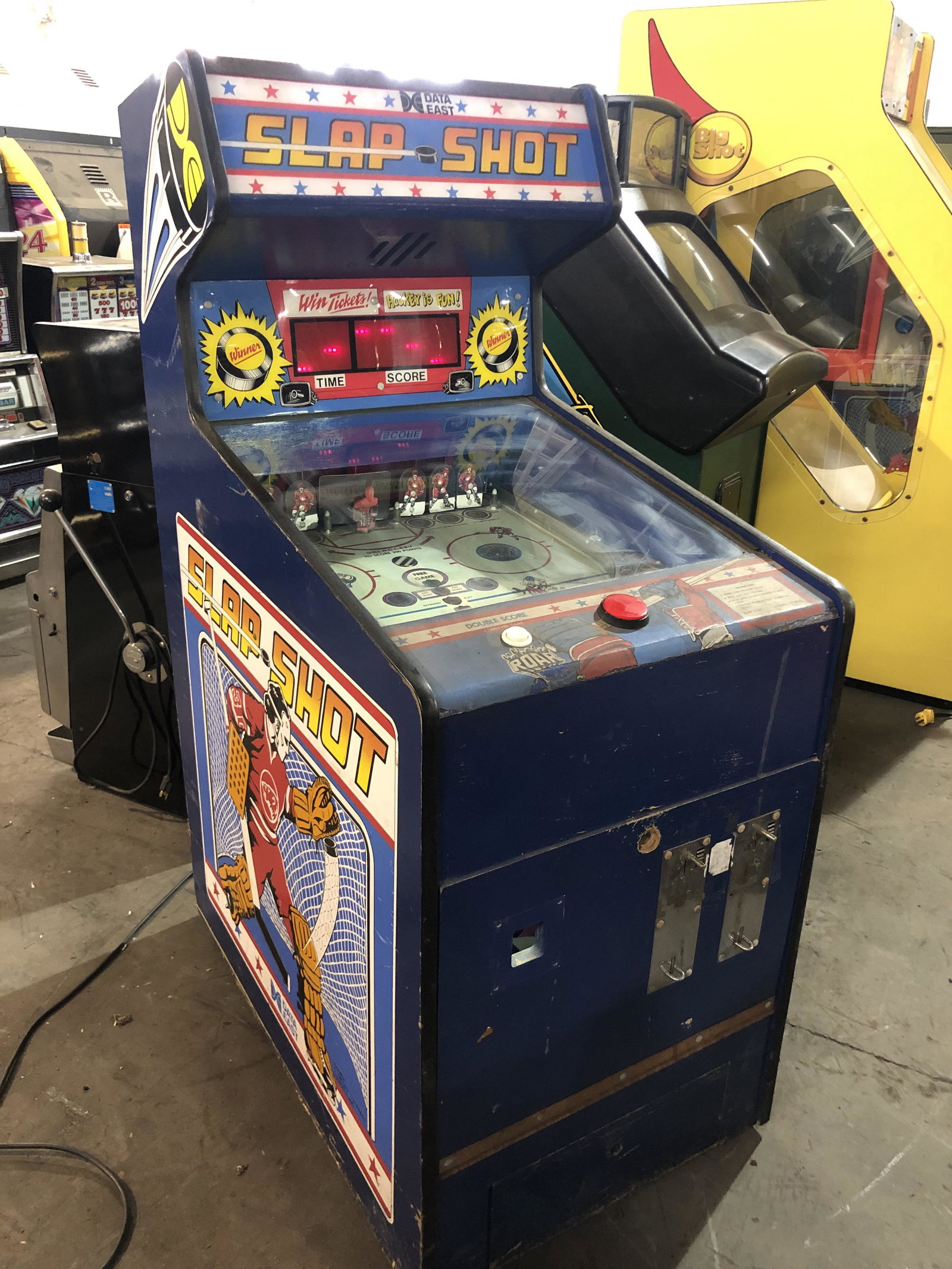 Data East Slap Shot Hockey Arcade Game: Data East Slap Shot Hockey Arcade Game. Powers on but doesn't coin up. This item requires third party shipping or pickup arrangements to be made. Dimensions: 58 x 24 x 37