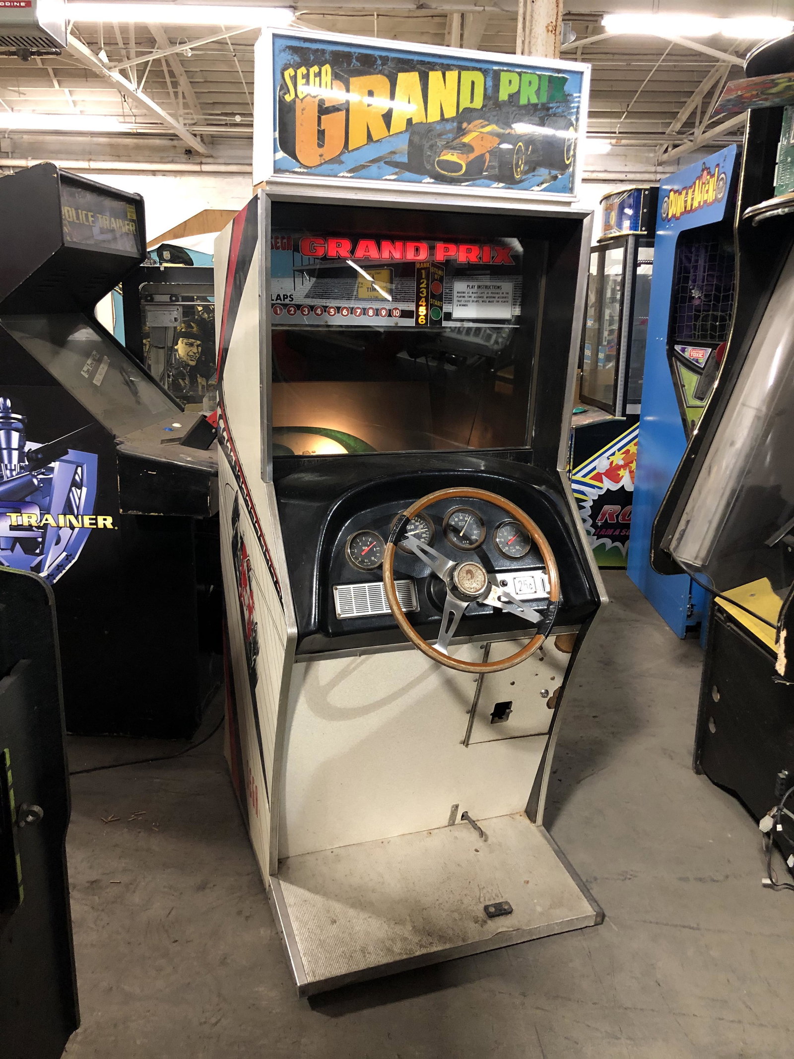 Sega Grand Prix Racing Arcade Game: Sega Grand Prix Racing Arcade Game. Not working, appears complete. This item requires third party shipping or pickup arrangements to be made. Dimensions: 76 x 29 x 44