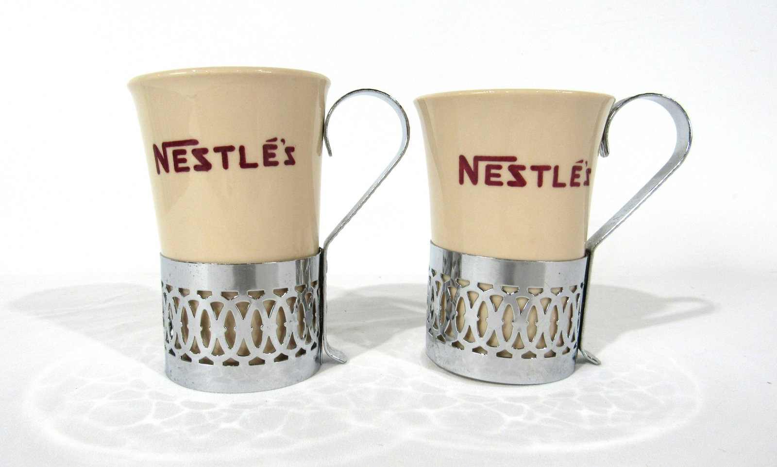 Vintage Nestle Hot Chocolate Mugs With Holder: Vintage Nestle Hot Chocolate Mugs With Holder. In-house shipping available. Dimensions: 4 x 4 x 3