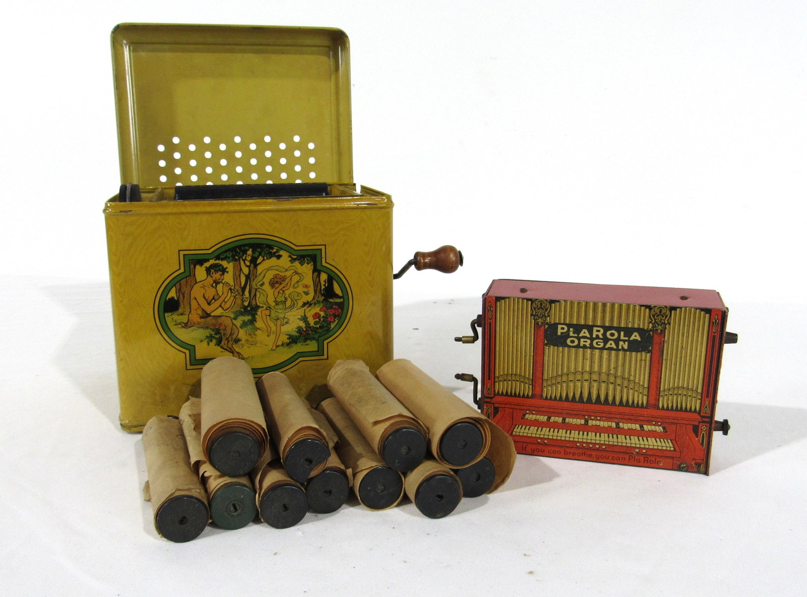 Melody Player and "PlaRola" Tin Litho Paper Roll Organ: Melody Player and "PlaRola" Tin Litho Paper Roll Organ with Rolls. In-house shipping available. Dimensions of Melody player: 7 x 9 x 7
