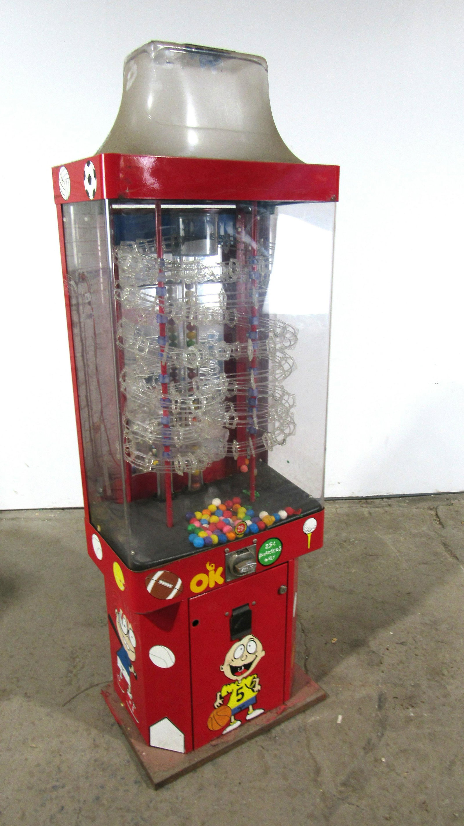 Rugrats Themed Beaver Sports Ball Gumball Machine: Rugrats Themed Beaver Coin Operated Sports Ball Gumball Vending Machine, Lot 1. Locks not included. Inside needs cleaning.This item requires third party shipping or pickup arrangements to be made. Dim
