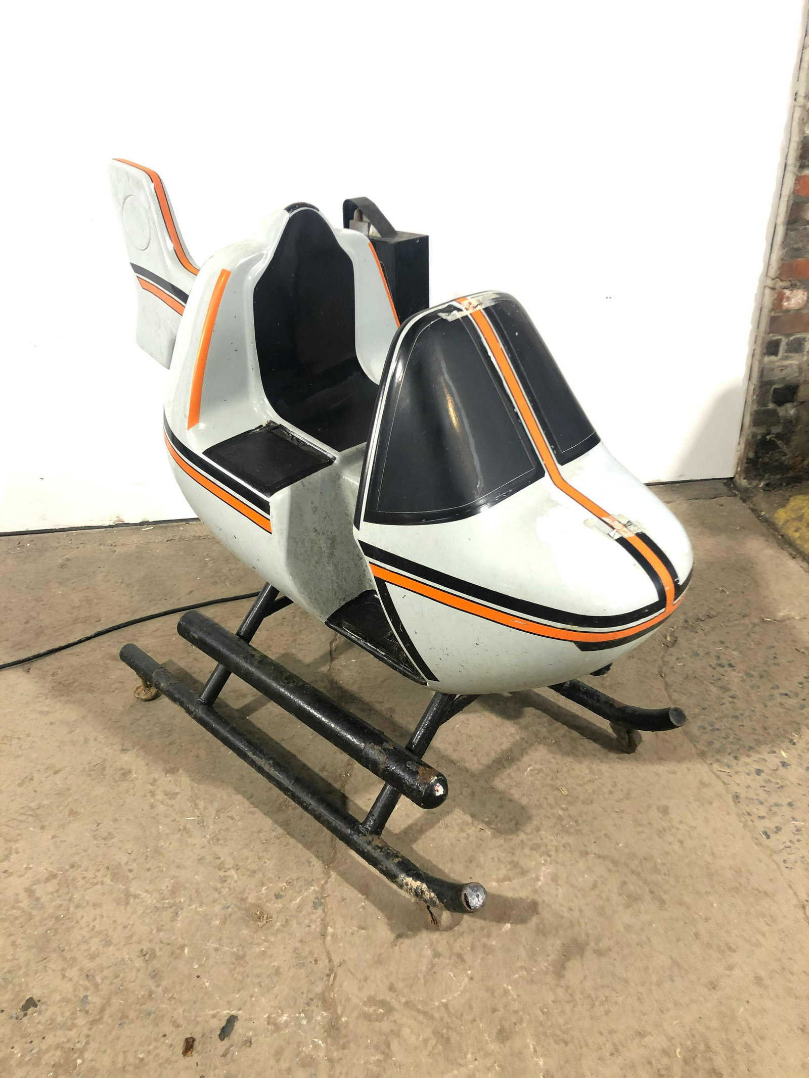 Helicopter Coin Operated Kiddie Ride: Helicopter Coin Operated Kiddie Ride. Working, no sound. Wear from outside storage. This item requires third party shipping or pickup arrangements to be made. Dimensions: 41 x 32 x 53