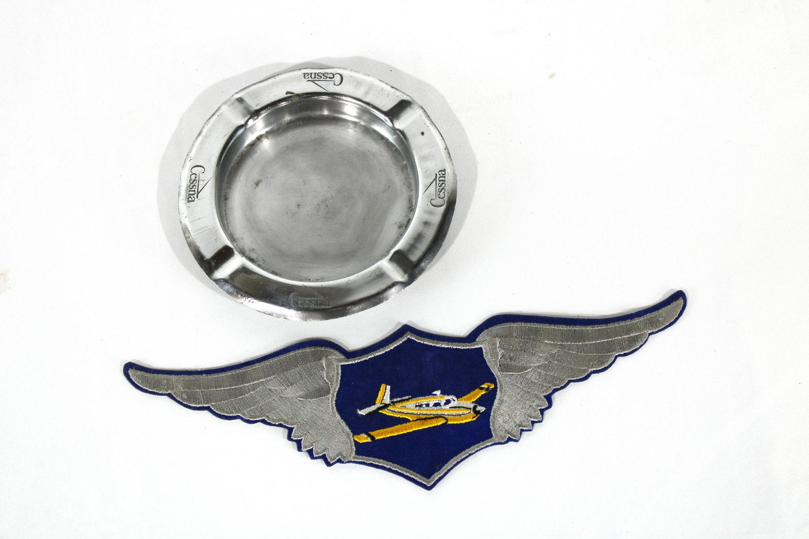 Vintage Cessna Ashtray with Airplane Patch: Vintage Cessna Ashtray with Airplane Patch. In-house shipping available. Dimensions of ashtray: 6 x 6 x 1