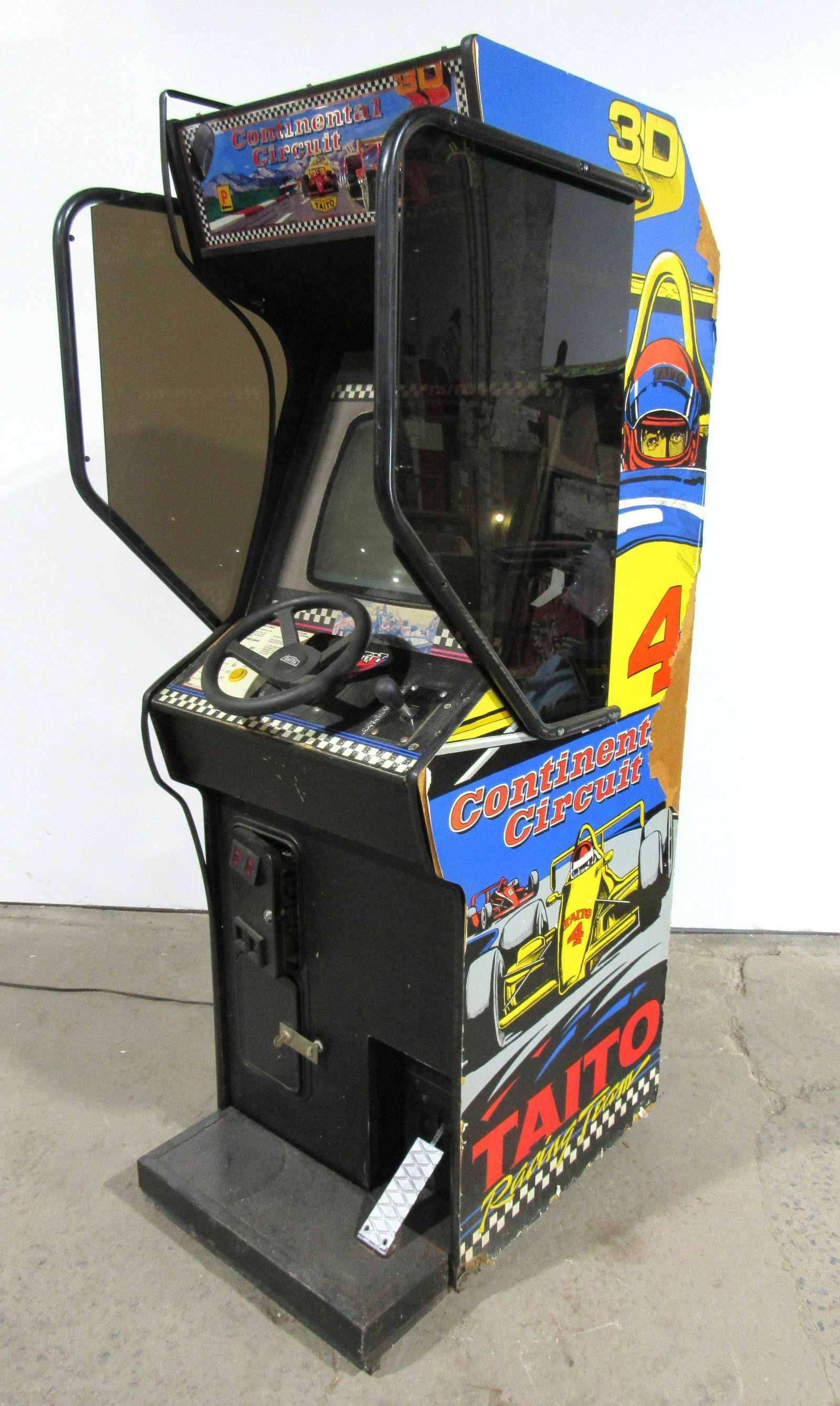 Taito Continental Circuit Racing Arcade Game: Taito Continental Circuit Racing Arcade Game, not working. No back door, otherwise appears complete. This item requires third party shipping or pickup arrangements to be made. Dimensions: 74 x 27 x 36
