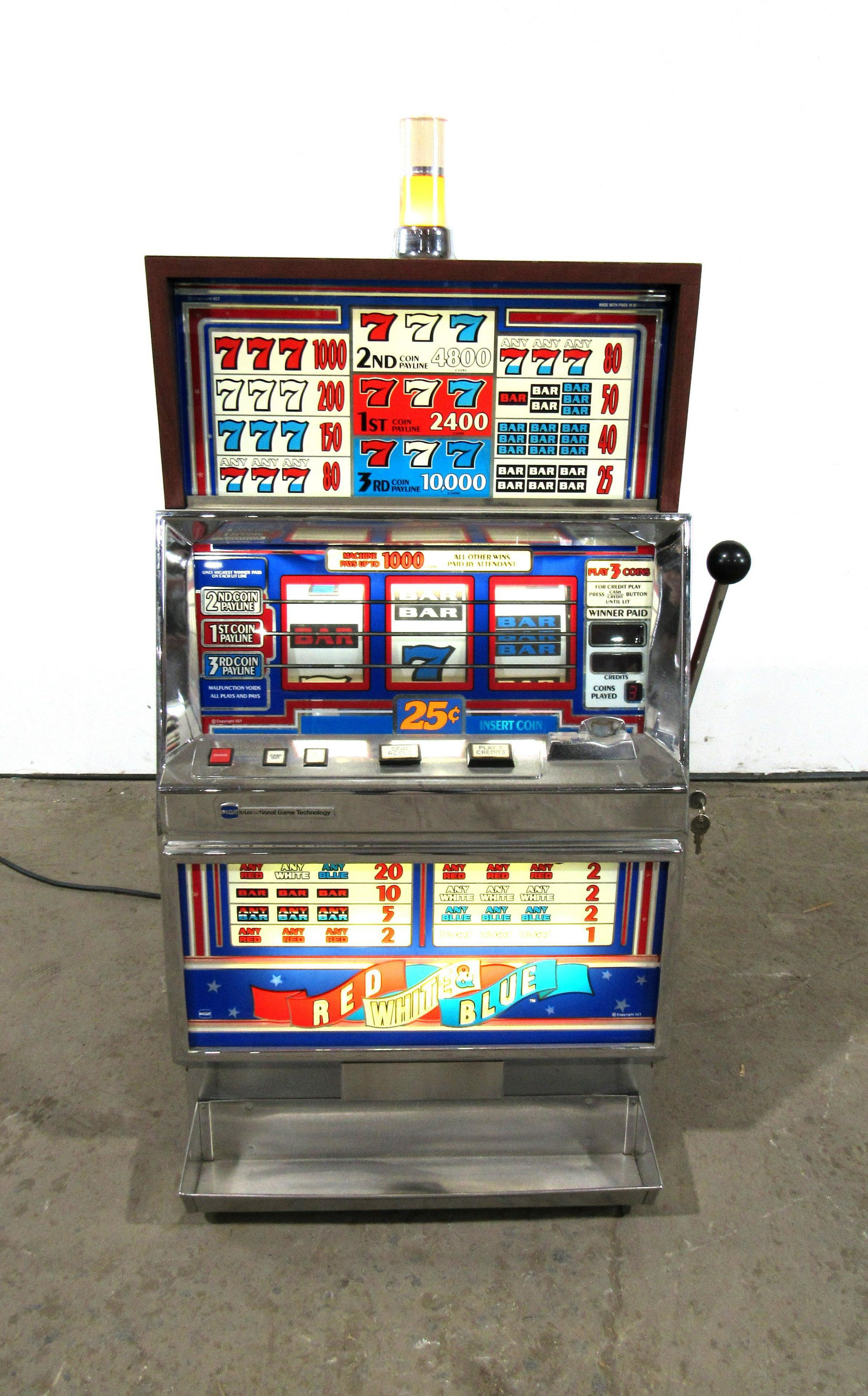 IGT Red, White & Blue Coin Operated Slot Machine: IGT Red, White & Blue Coin Operated Slot Machine. Working. This item requires third party shipping or pickup arrangements to be made. Dimensions: 46 x 25 x 21
