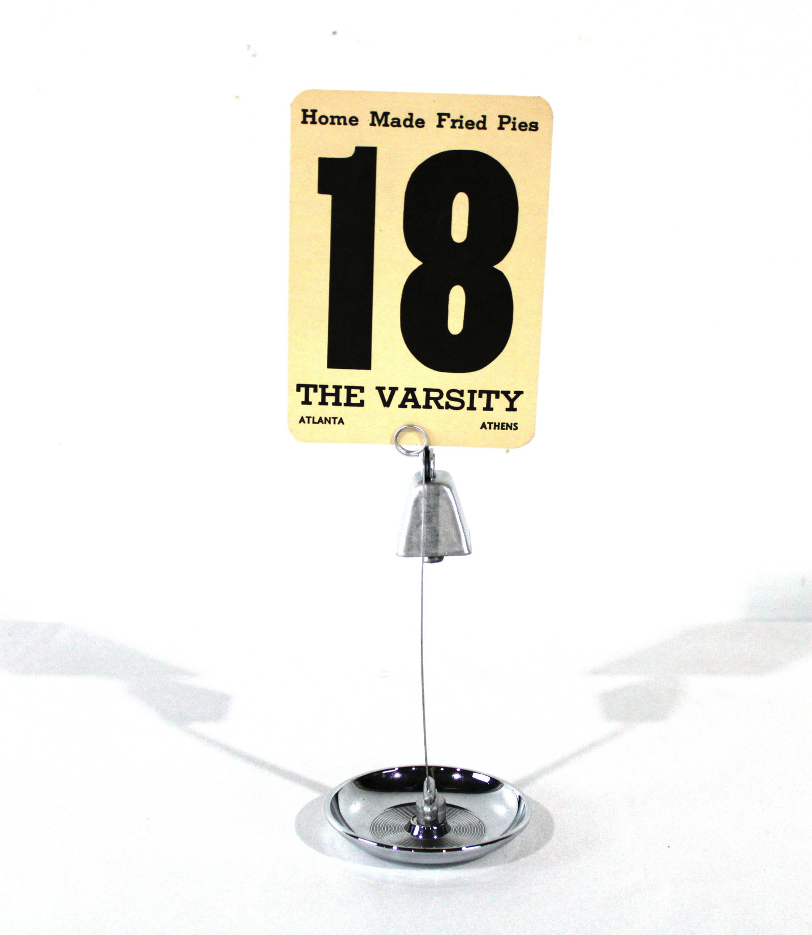 Diner Table Call Bell with Varsity Drive-In Menu Card: Diner Table Call Bell with Varsity Drive-In Menu Card. In-house shipping available. Dimensions of Stand: 6 x 3 x 3