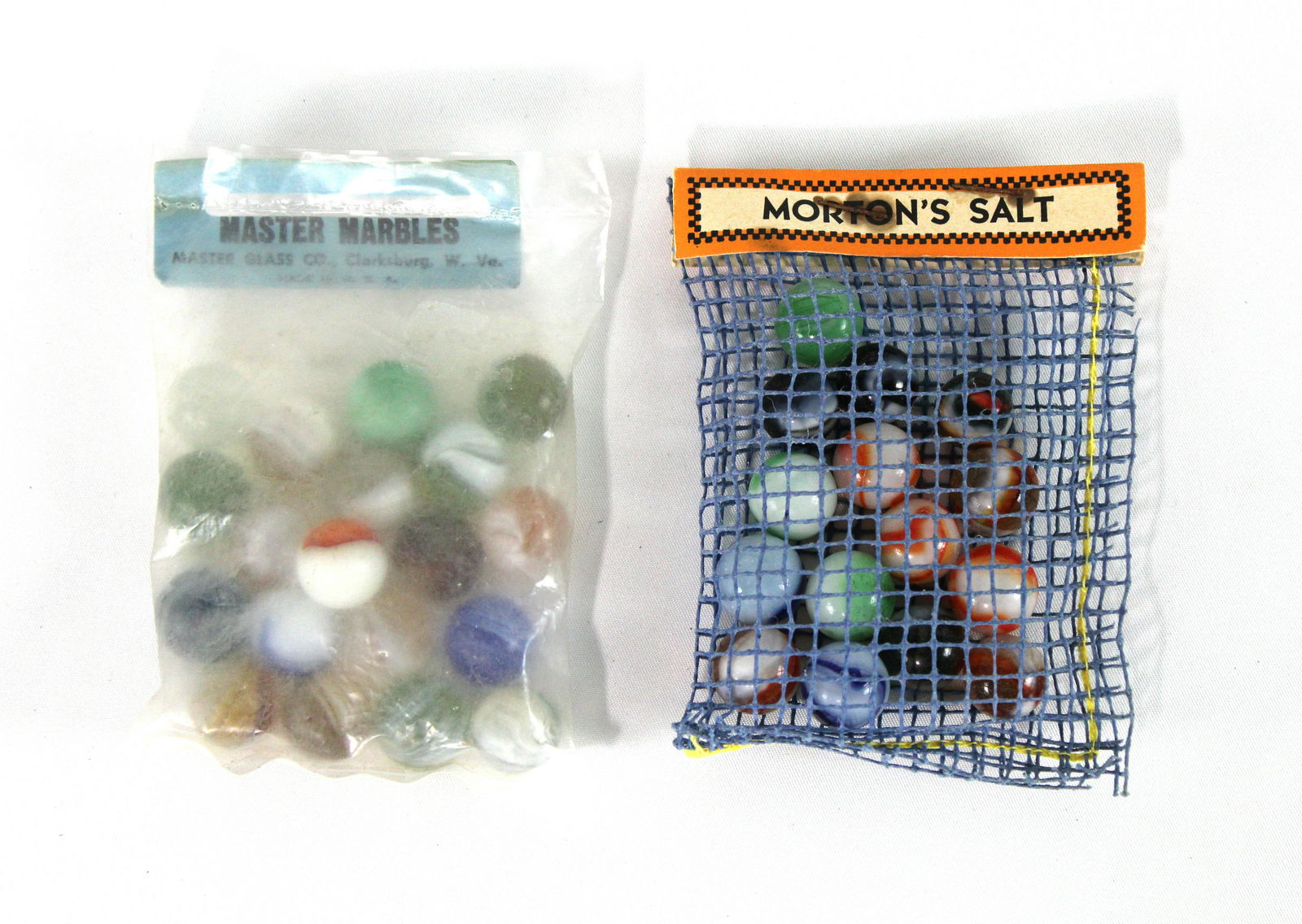 Master Marbles and "Morton's Salt" Marbles Bags: Sealed Plastic Bag of Master Marbles Together with Mint Net Bag of "Morton's Salt" Marbles. In-house shipping available.