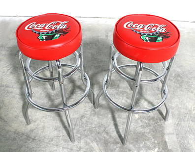 Pair of Coca Cola Themed Bar Stools: Pair of Coca Cola Themed Bar Stools. This item requires third party shipping or pickup arrangements to be made. Dimensions of One: 29 x 22 x 22