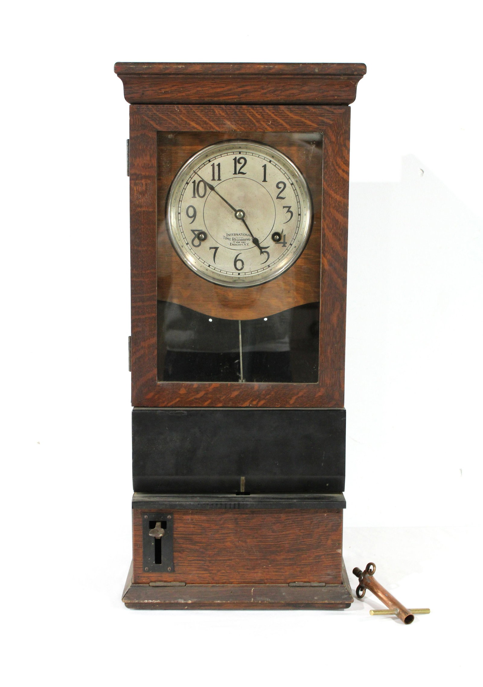 International Time Recording Co. Wooden Clock: International Time Recording Co. Wooden Clock. No key. This item requires third party shipping or pickup arrangements to be made. Dimensions: 31 x 13.5 x 10