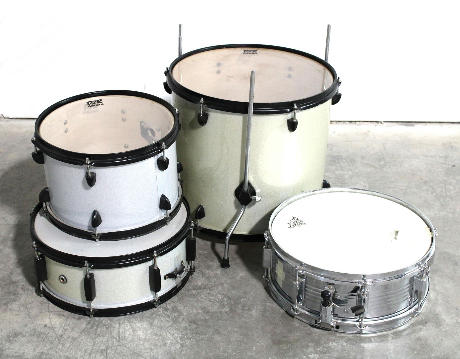 Drums including D2R and Remo: Drums including D2R and Remo. This item requires third party shipping or pickup arrangements to be made. Dimensions of Largest: 19 x 18 x 18