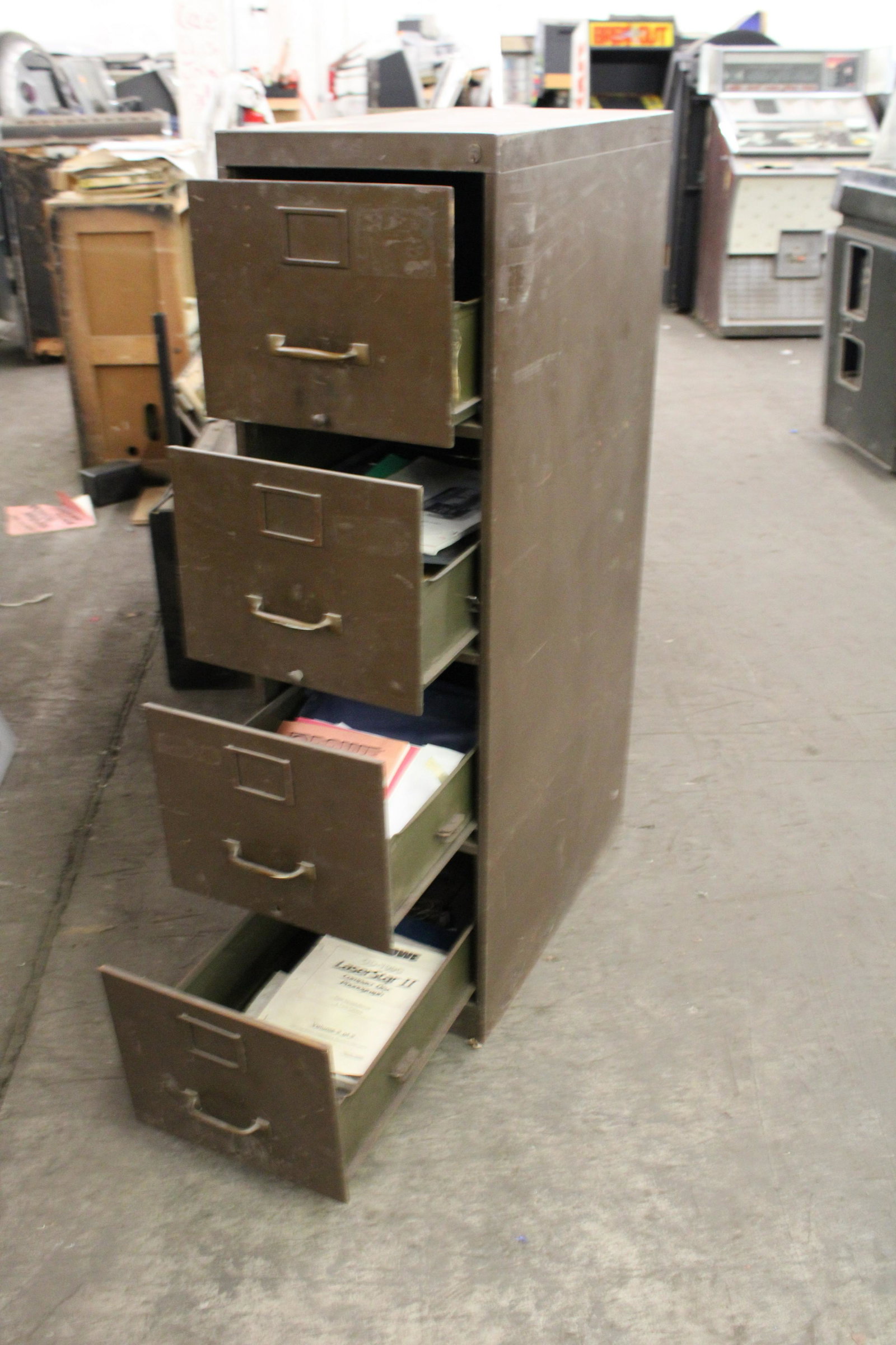 Industrial Filing Cabinet with Arcade Manuals: Industrial Filing Cabinet with Arcade Manuals. Mid Century Modern cabinet with jukebox and other manuals.