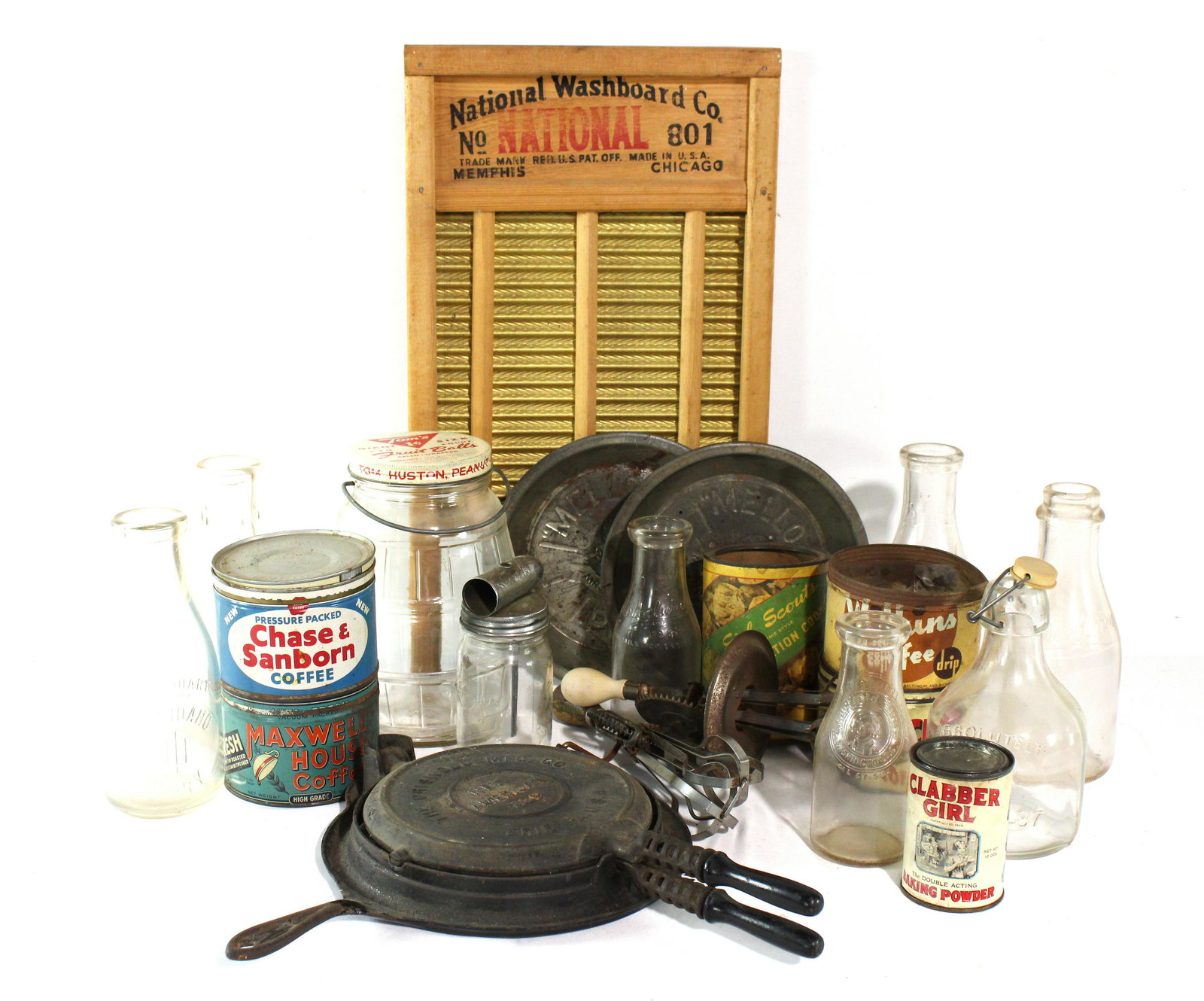 Assorted Primatives incl. Griswald Cast Iron No. 9 Waffle Maker: Assorted Primatives incl. Griswald Cast Iron No. 9 Waffle Maker. Also includes vintage food cans and dairy bottles. Dimensions of Griswold: 3 x 16 x 18. *Shipping now available via Live Shipping throu