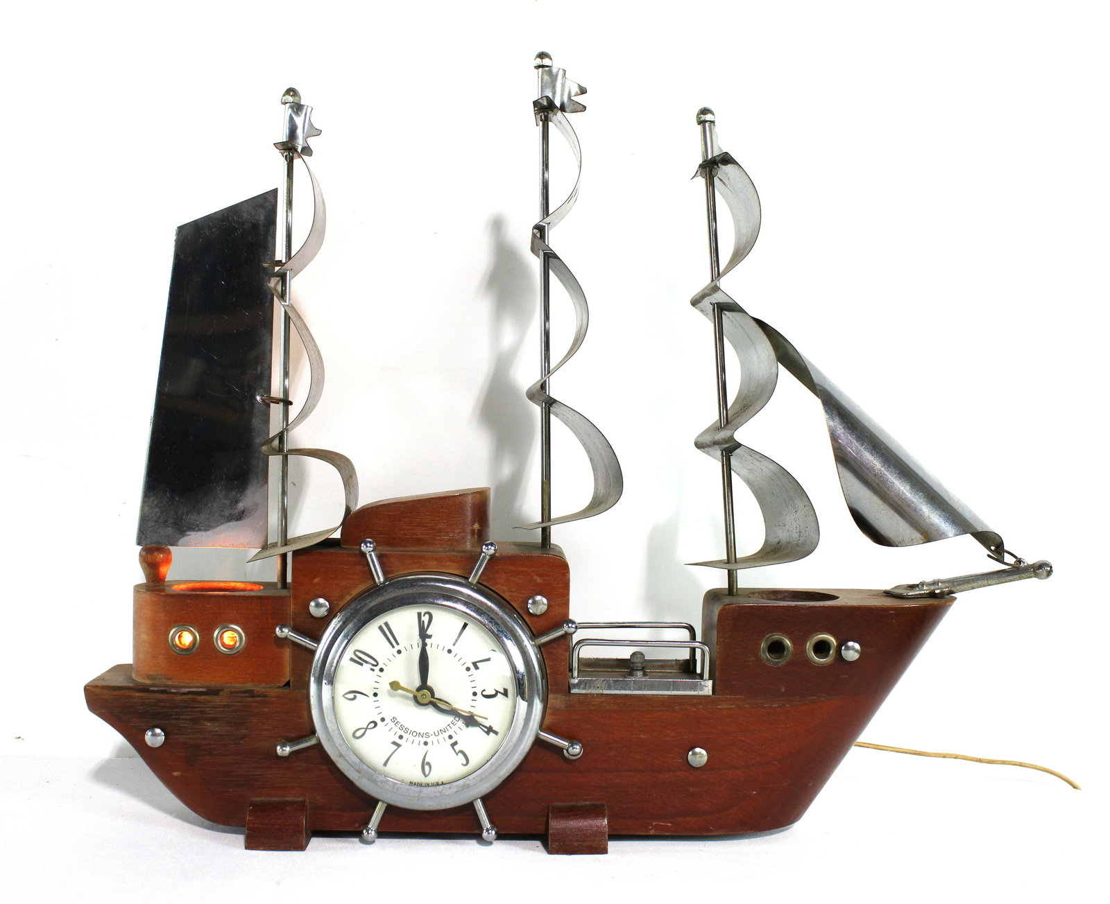 MCM Wooden Light Up Boat Clock: Mid Century Modern Wooden Light Up Boat Clock. Dimensions: 16 x 19 x 4. *Shipping now available via Live Shipping through Live Auctioneers. Please see terms for more details.