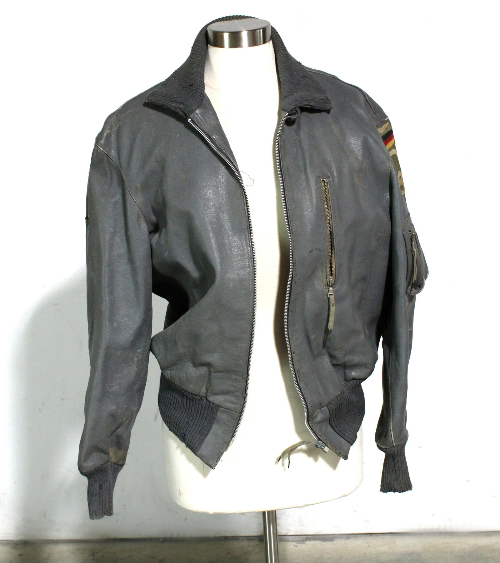 German Luftwaffe Leather Jacket: German Luftwaffe Leather Jacket. Regulation jacket issued to German Air Force and Army Pilots. "Official Issue" Made by International Outerwear. Dusty, vintage condition. Dimensions: 20 x 18 (pit to p