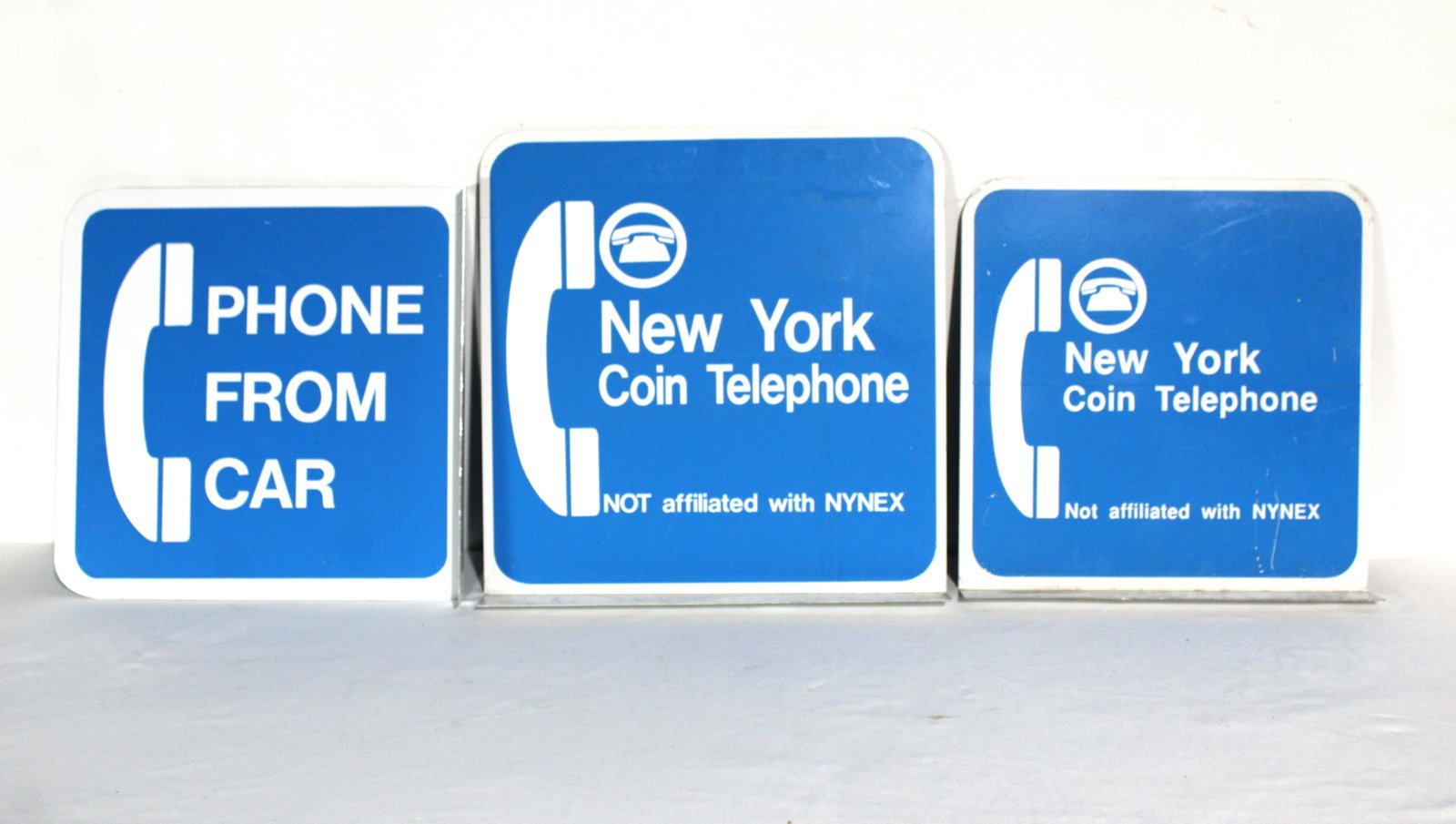 Metal Flange Telephone Signs, New York: Metal Flange Telephone Signs, New York. In-house shipping available. Dimensions of largest: 18 x 18 x 2