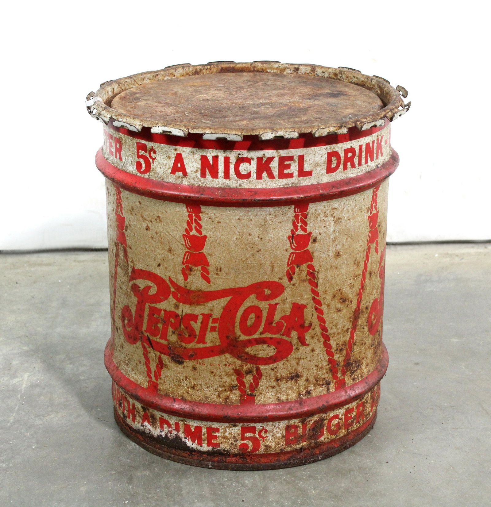 Pepsi-Cola Metal Syrup Drum: Pepsi-Cola Metal Syrup Drum. This item requires third party shipping or pickup arrangements to be made. Dimensions: 18 x 16 x 16