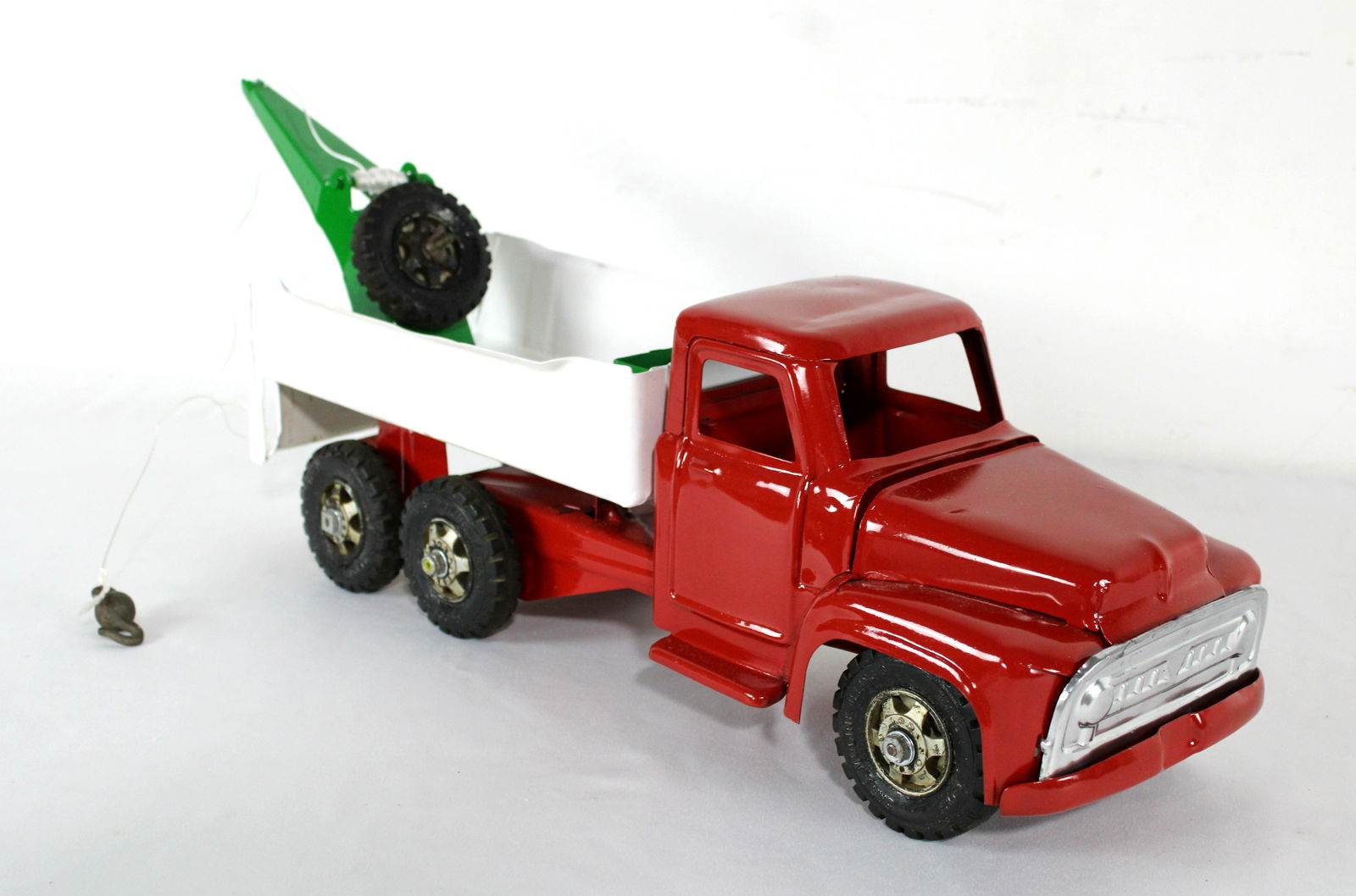 Buddy L Toy Tow Truck: Buddy L Toy Tow Truck. Truck has been repainted. In-house shipping available. Dimensions: 8 x 7 x 24