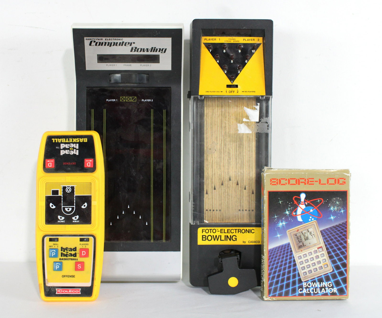Handheld Games incl. Cadaco Bowling, and Head to Head Basketball: Handheld Games incl. Cadaco Bowling, and Head to Head Basketball. Basketball does not have battery cover. In-house shipping available. Dimensions of One: 15 x 6 x 3