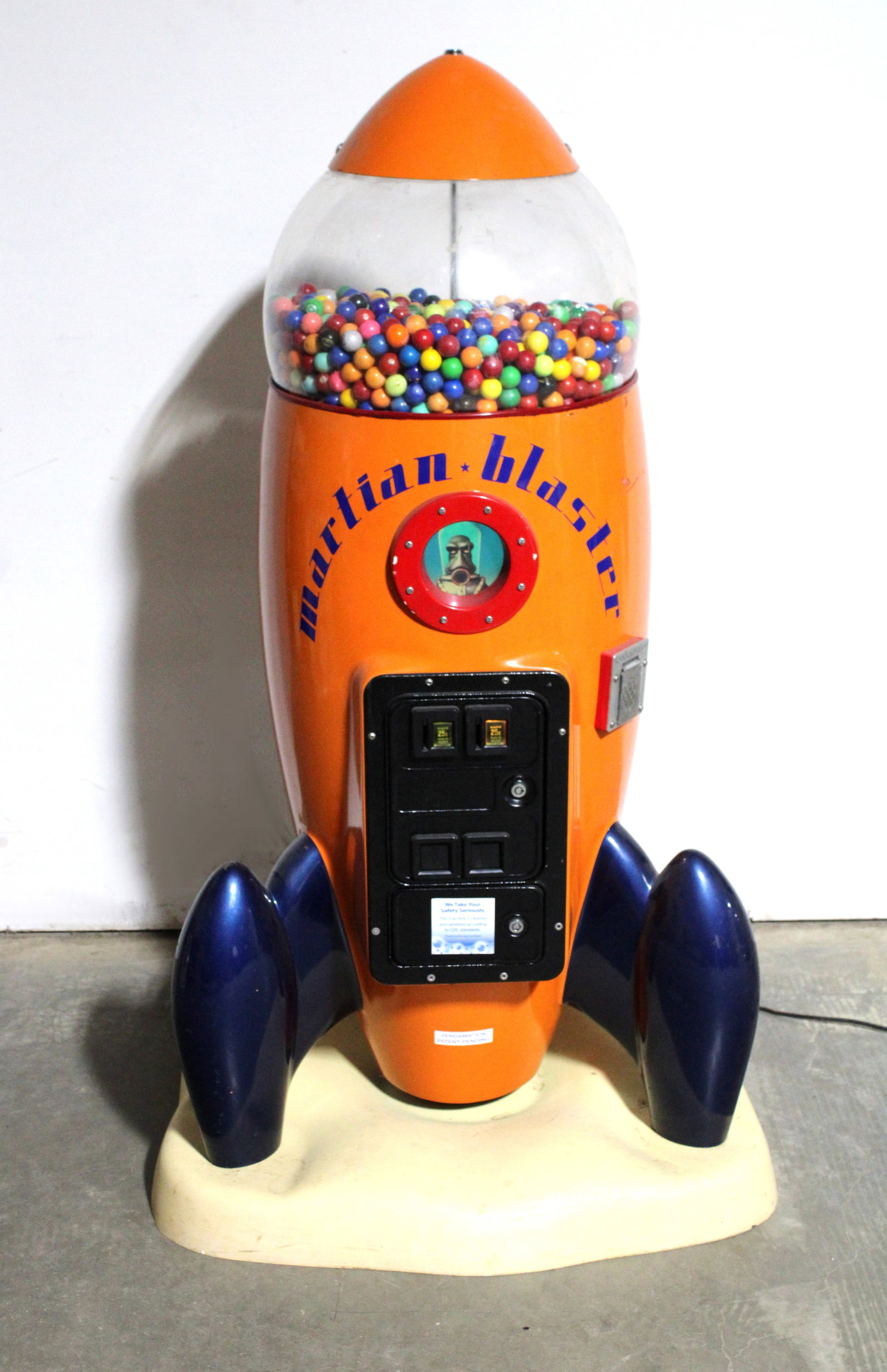 Martian Blaster Coin Op Rocket Gumball: Martian Blaster Coin Op Rocket Gumball. Working with sound. Video screen not reliable. Locked, no key. This item requires third party shipping or pickup arrangements to be made. Dimensions: 57 x 34 x 