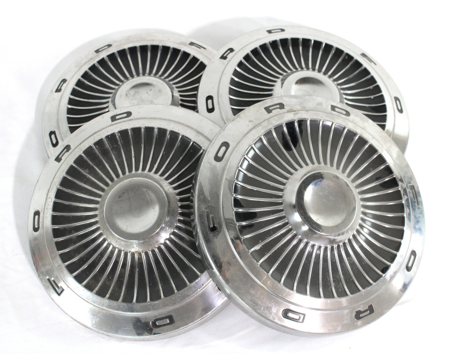Set of Ford Car Hubcaps: Set of Ford Car Hubcaps. In-house shipping available. Dimensions of one: 11 x 11 x 3