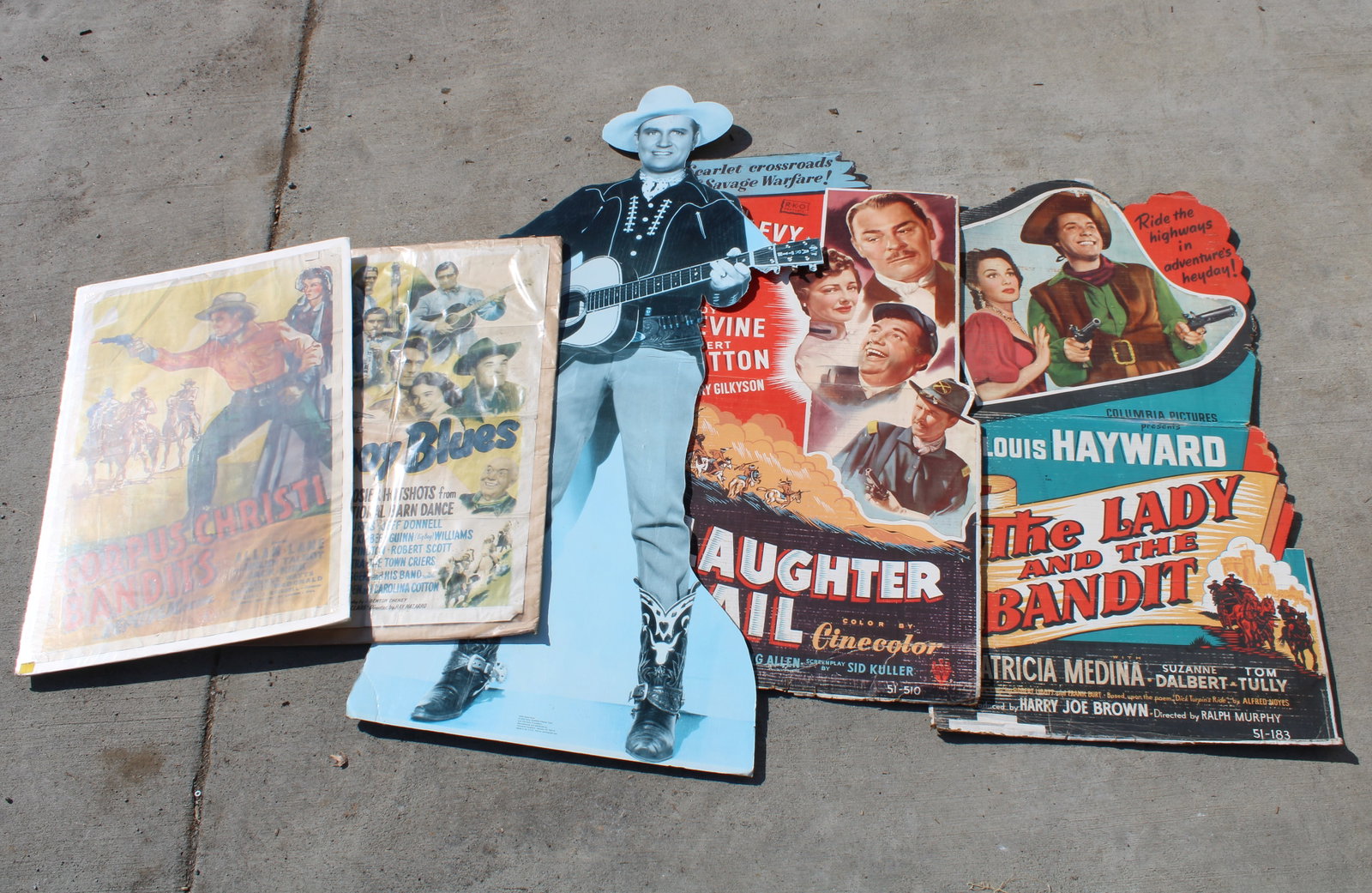 Western Themed Movie Theater Marquees: Western Themed Movie Theater Marquees including "The Lady and The Bandit" and "Cowboy Blues." All show wear, some water damage. This item requires third-party shipping or pickup arrangements to be mad