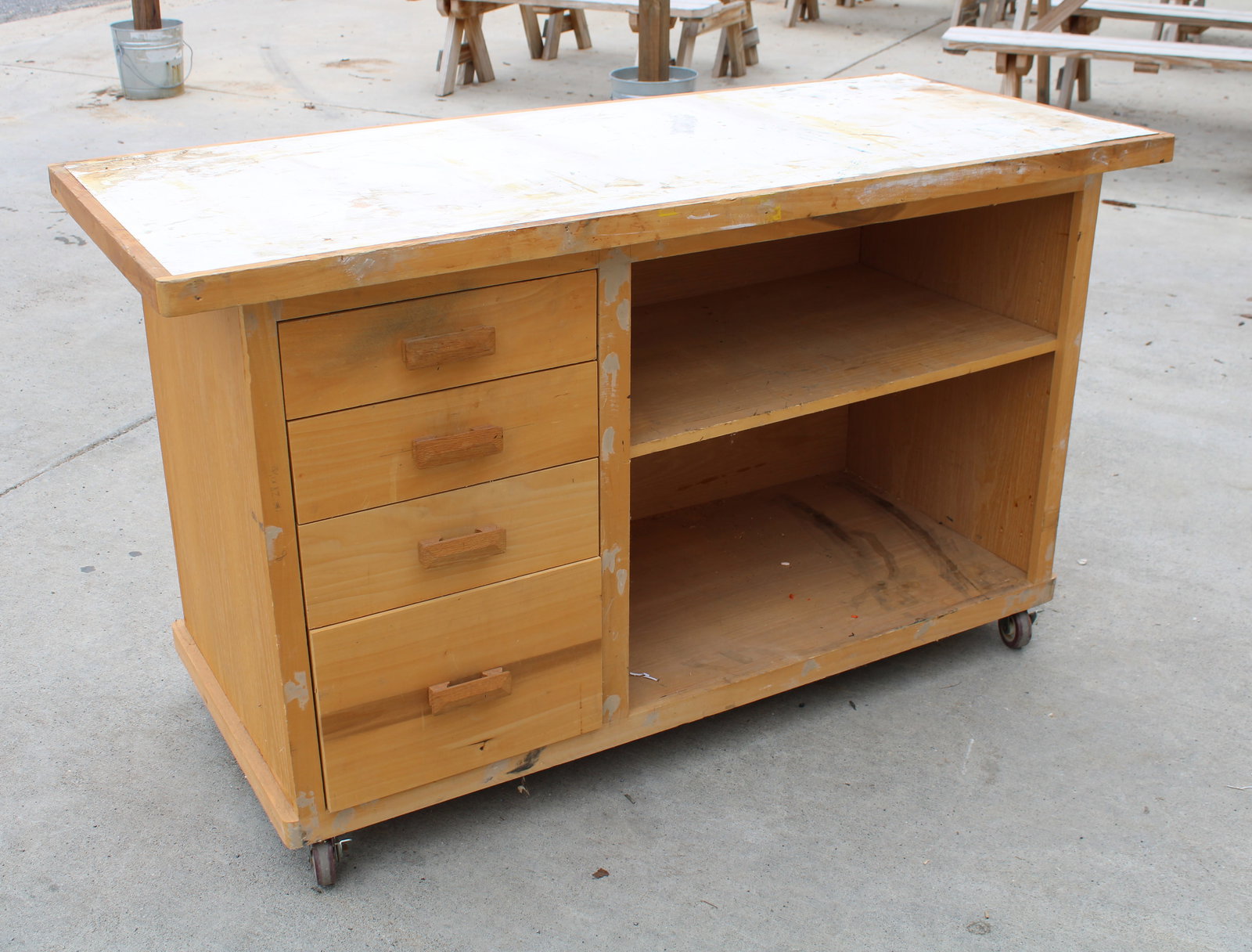 Work Table with Drawers: On wheels. This item requires third-party shipping or pickup arrangements to be made. Dimensions: 35 x 60 x 26