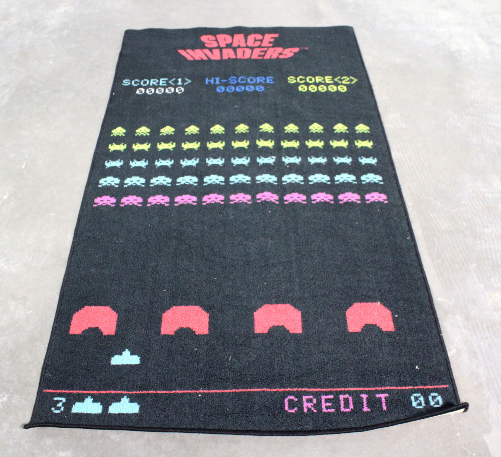 Space Invaders Arcade Themed Area Rug: This item requires third-party shipping or pickup arrangements to be made. Dimensions: 71 x 39