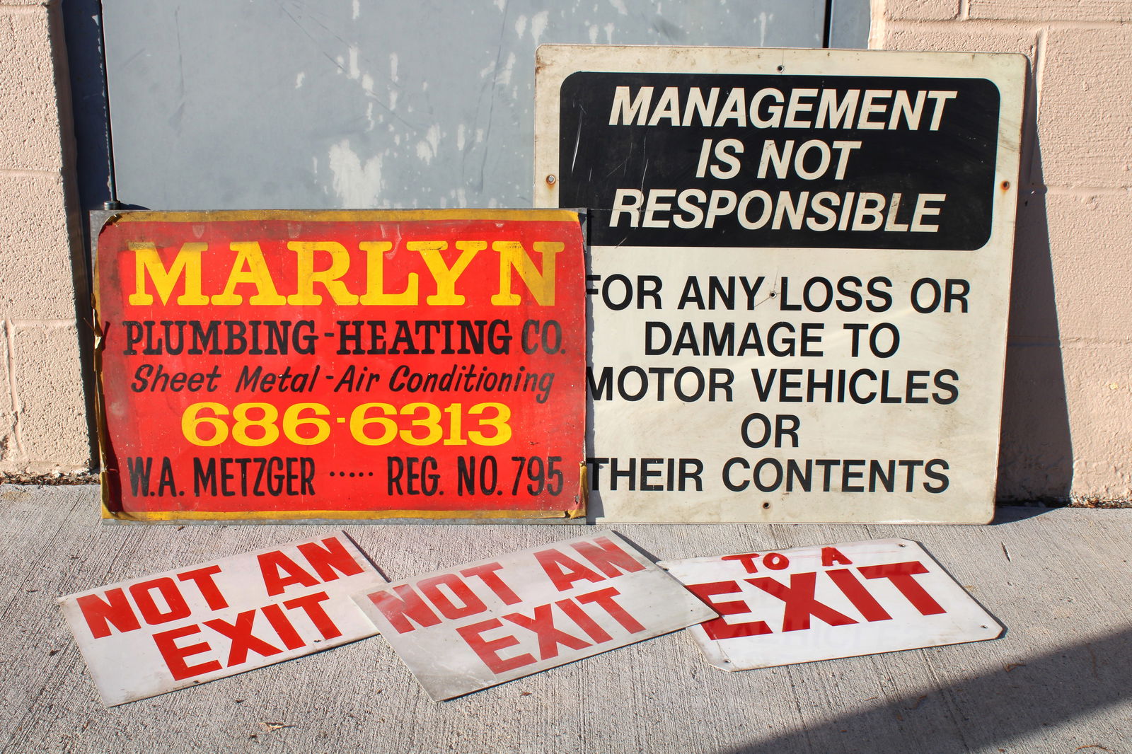 Assorted Signs incl. Exit and Marlyn Plumbing and Heating (1 of 1)