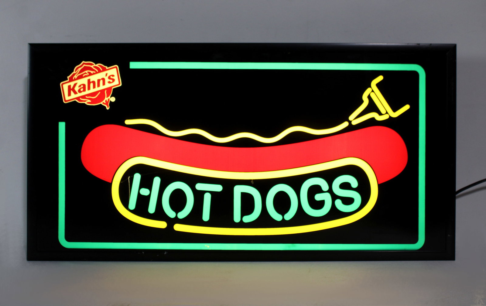 Kahn's Hot Dogs Light Up Sign: Working. Crack on front. This item requires third-party shipping or pickup arrangements to be made. Dimensions: 13 x 26 x 3