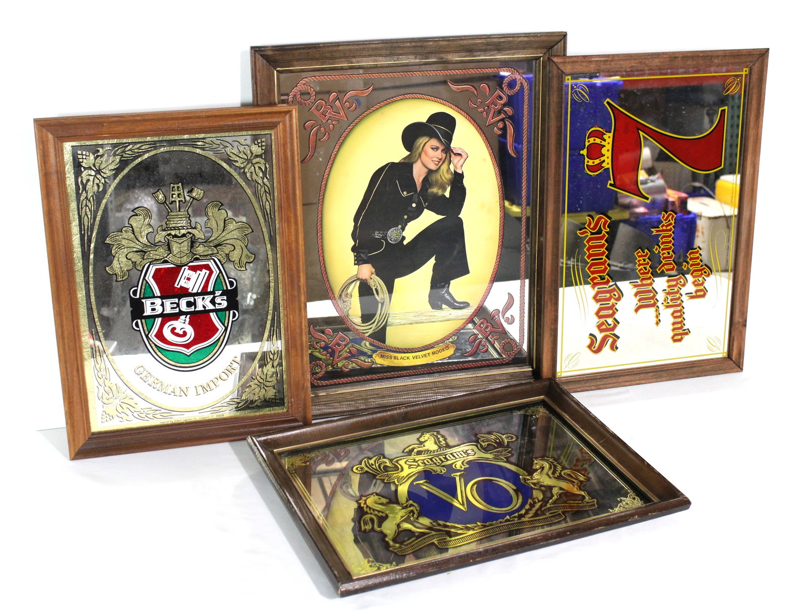 Whiskey / Beer Mirrors incl. Seagrams, Beck's and Black Velvet: This item requires third-party shipping or pickup arrangements to be made. Dimensions of one: 23 x 19 x 1